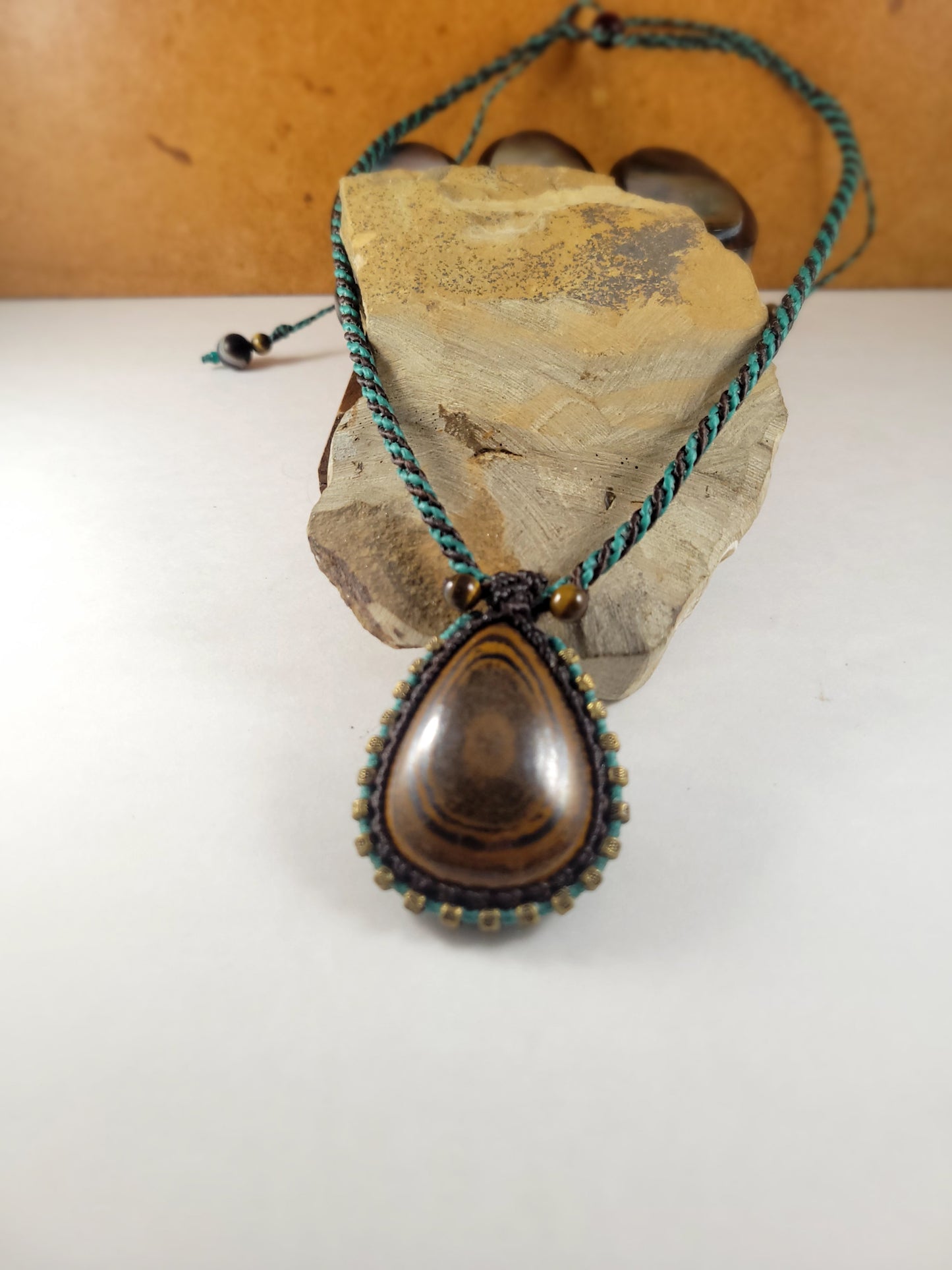 Iron Tiger Eye Pendant Necklace – Black & Blue Macrame with Brass Beads, 16” Bead Closure