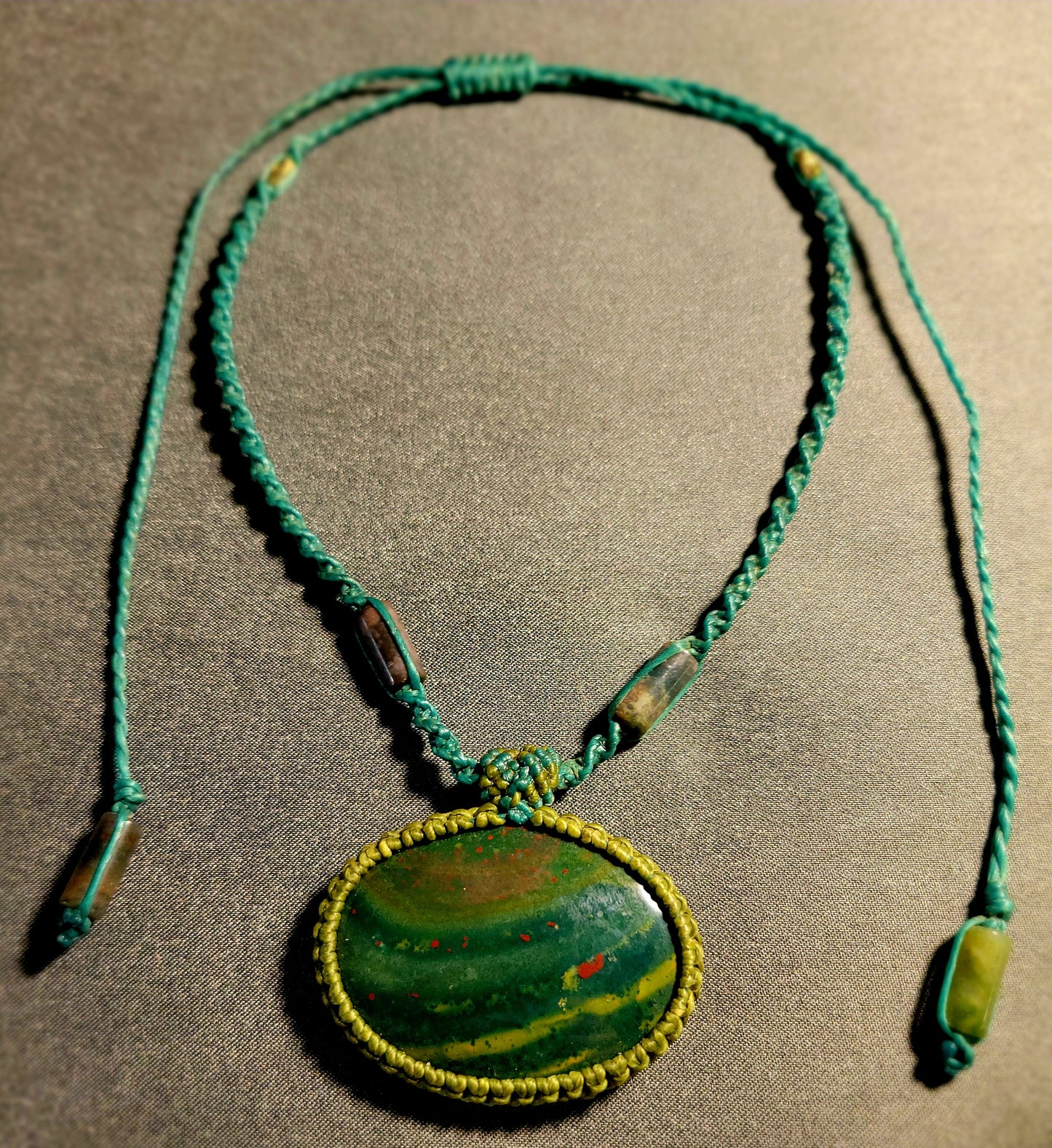 Orbicular Bloodstone Pendant – Natural stone pendant on waxed cotton cord with moss agate bead accents.