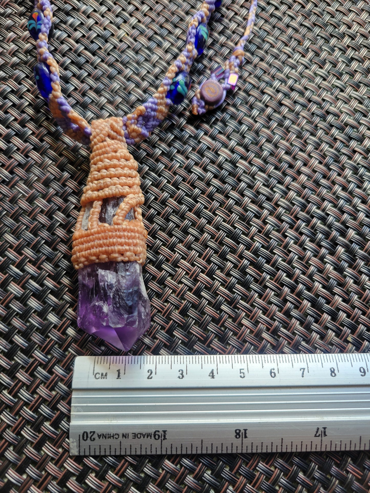 “Sacred Bloom” – Raw Amethyst Crystal Pendant Necklace, Purple & Tan Woven Cord with Blue Beads, Adjustable Feminine Jewelry