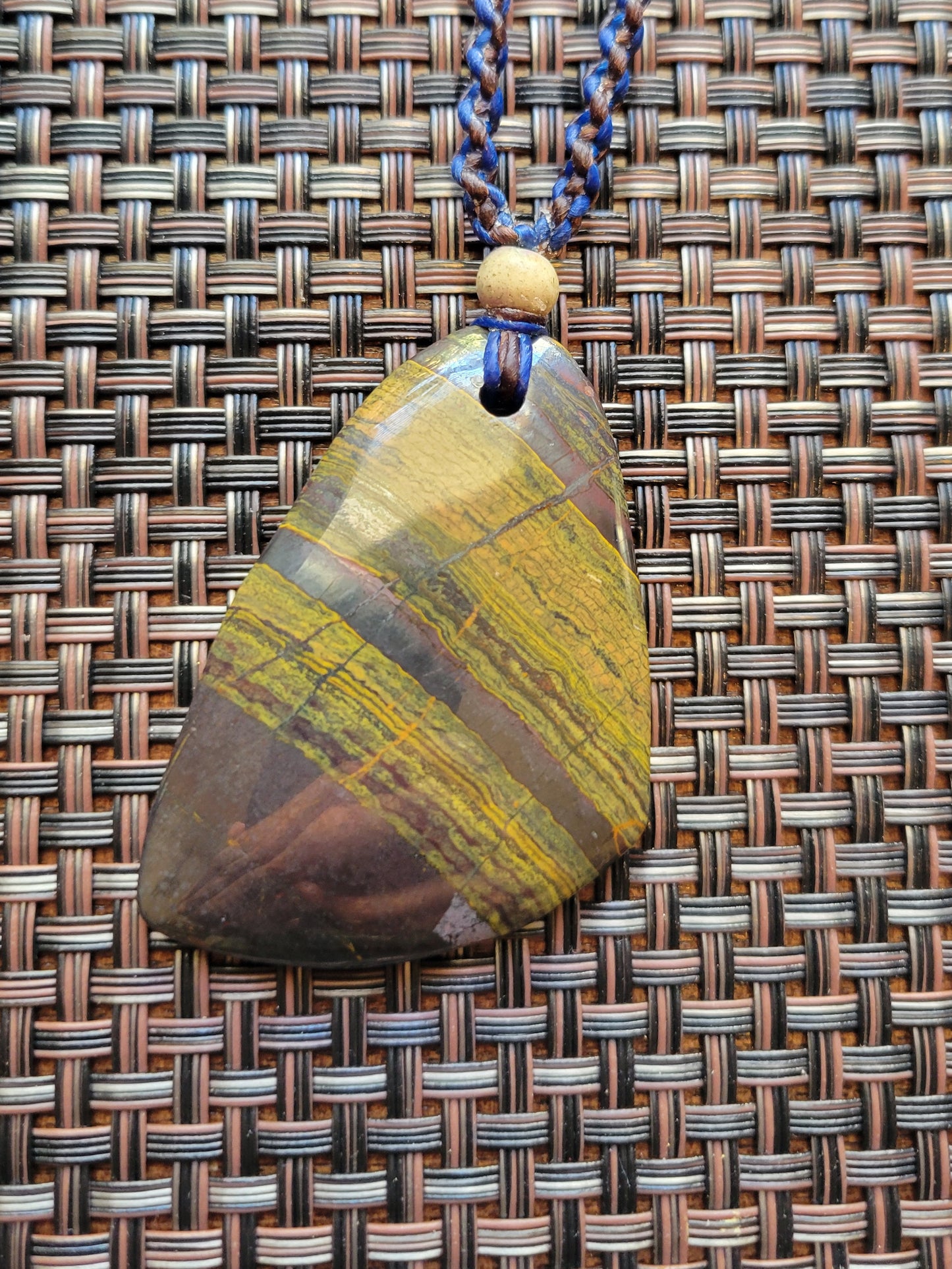 “Strength in Stillness” – Iron Tiger Eye Pendant Necklace, Blue Cord with Clear Quartz Beads, Adjustable
