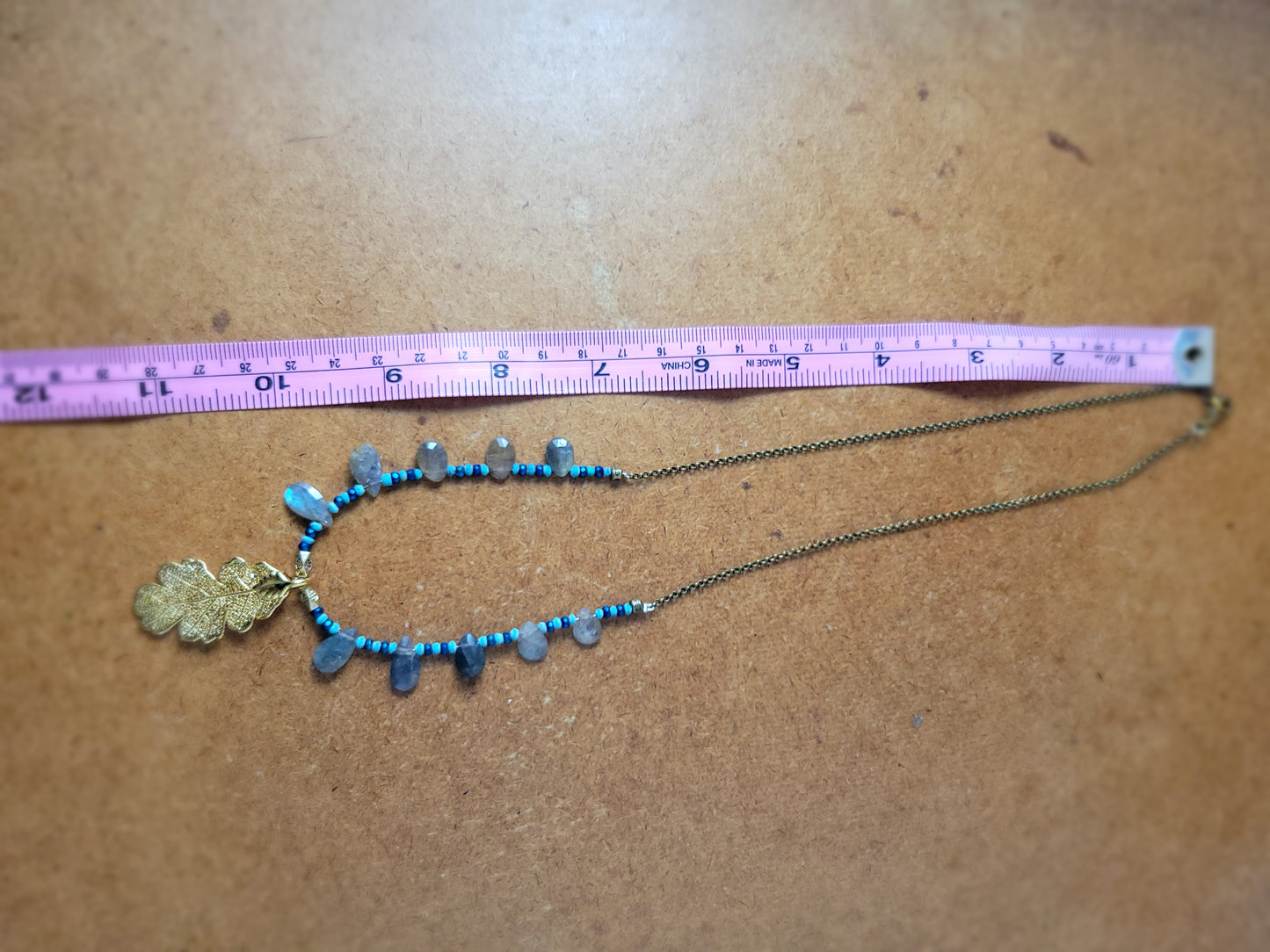 Nature-inspired Brass Leaf Pendant Necklace with Aura Titanium beads