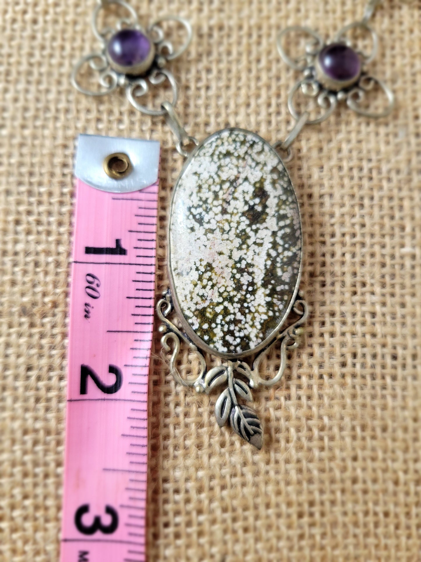 Close up of Snowflake Obsidian and Amethyst Necklace boho style