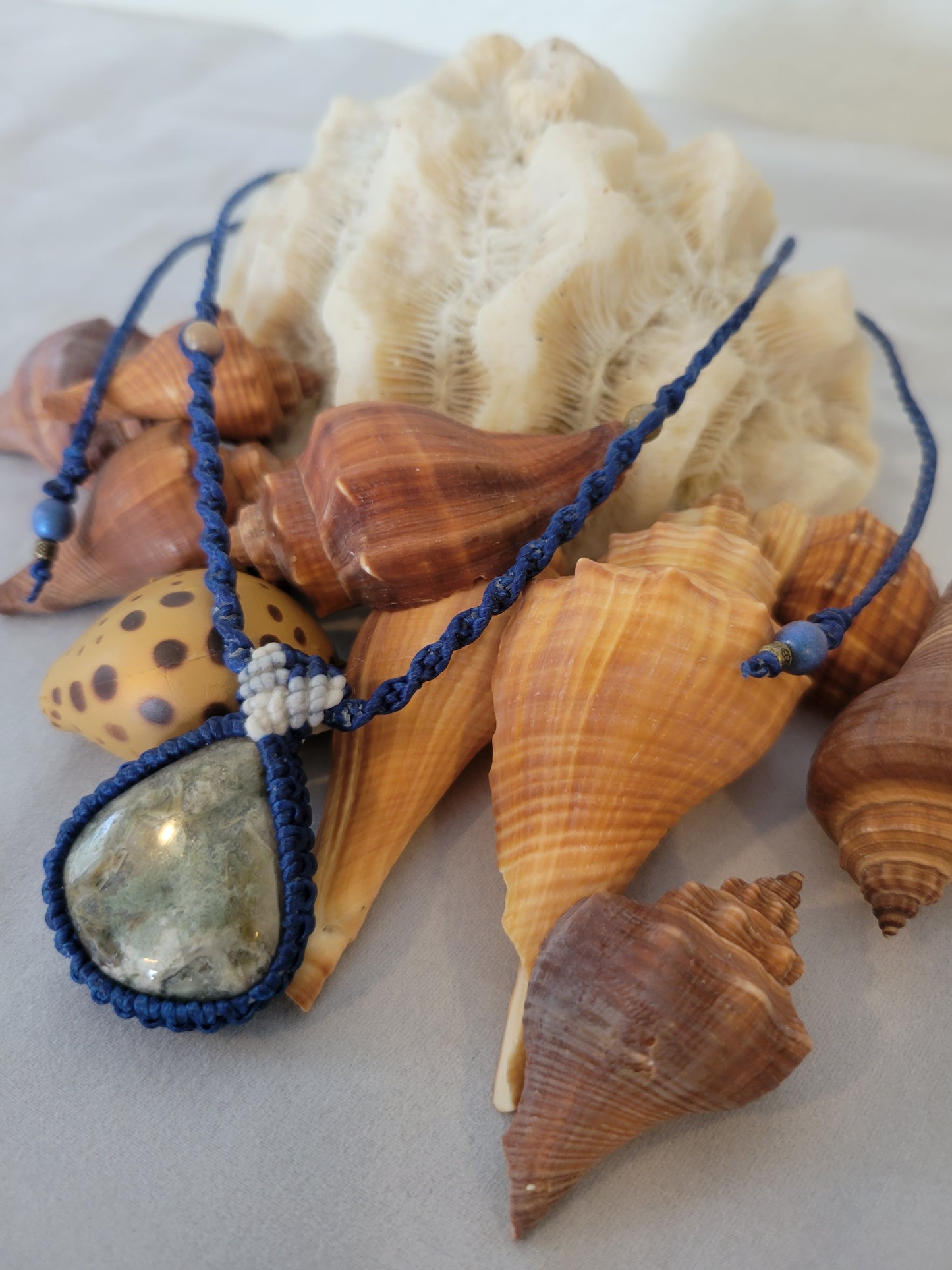 Mist Over Canopy” – Rainforest Rhyolite Pendant Necklace, Blue Cord with White Accents, Adjustable