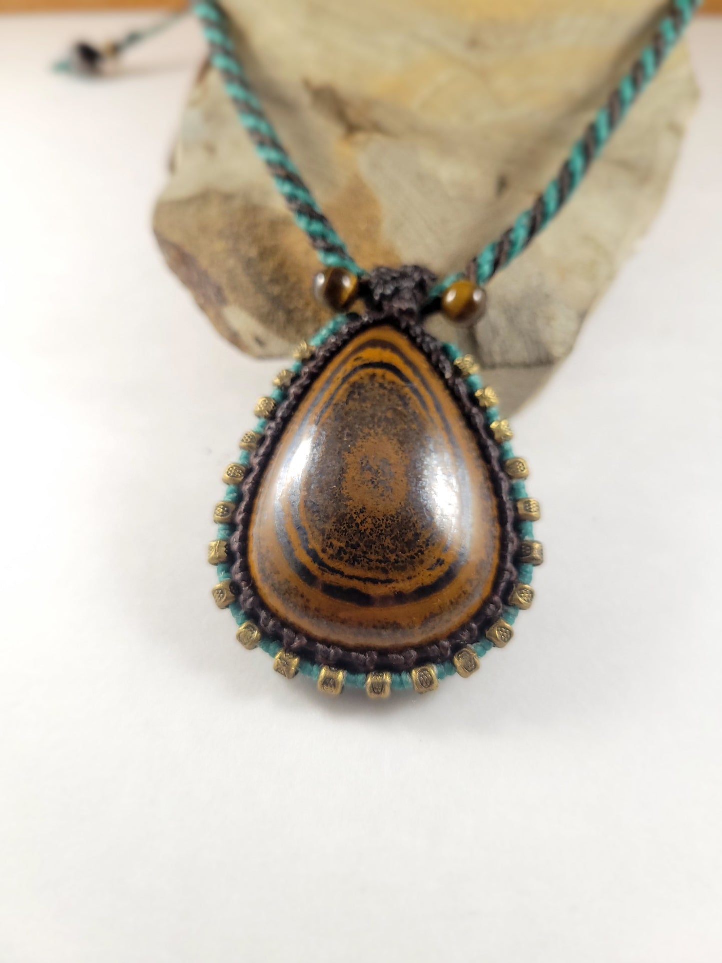 Iron Tiger Eye Pendant Necklace – Black & Blue Macrame with Brass Beads, 16” Bead Closure
