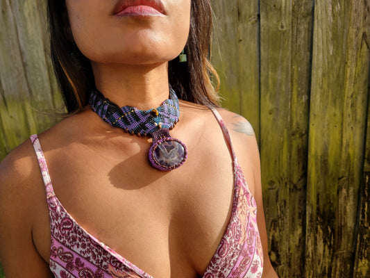 Amethyst Crystal Pendant displayed on a woman wearing a boho choker necklace with geometric micromacramé design.