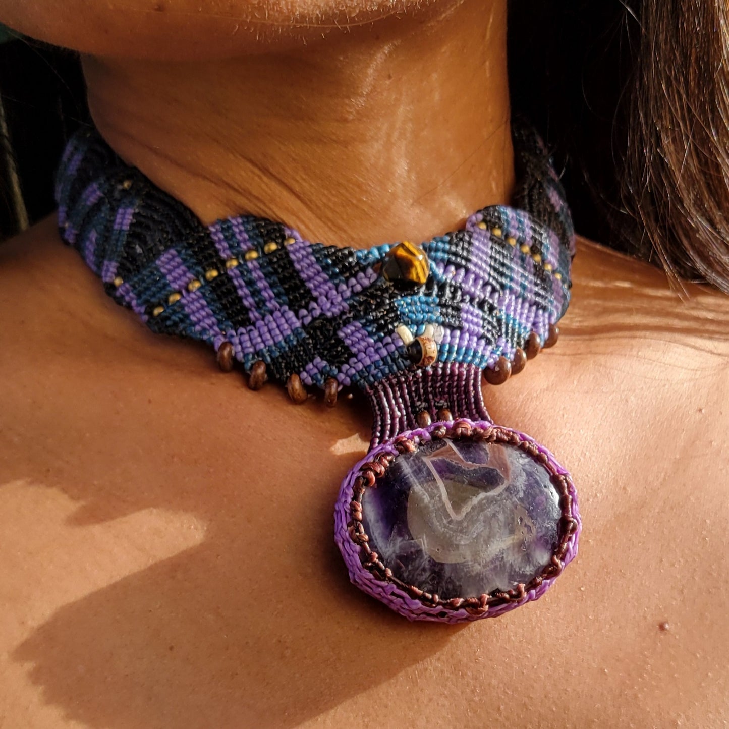 Amethyst Crystal Pendant featured in a wide micromacramé choker with mixed purple cord and a large natural amethyst stone.