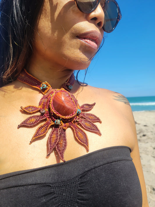 Boho Choker Necklace worn on the beach, featuring a sunburst design with natural agate stone and chrysocolla beads.