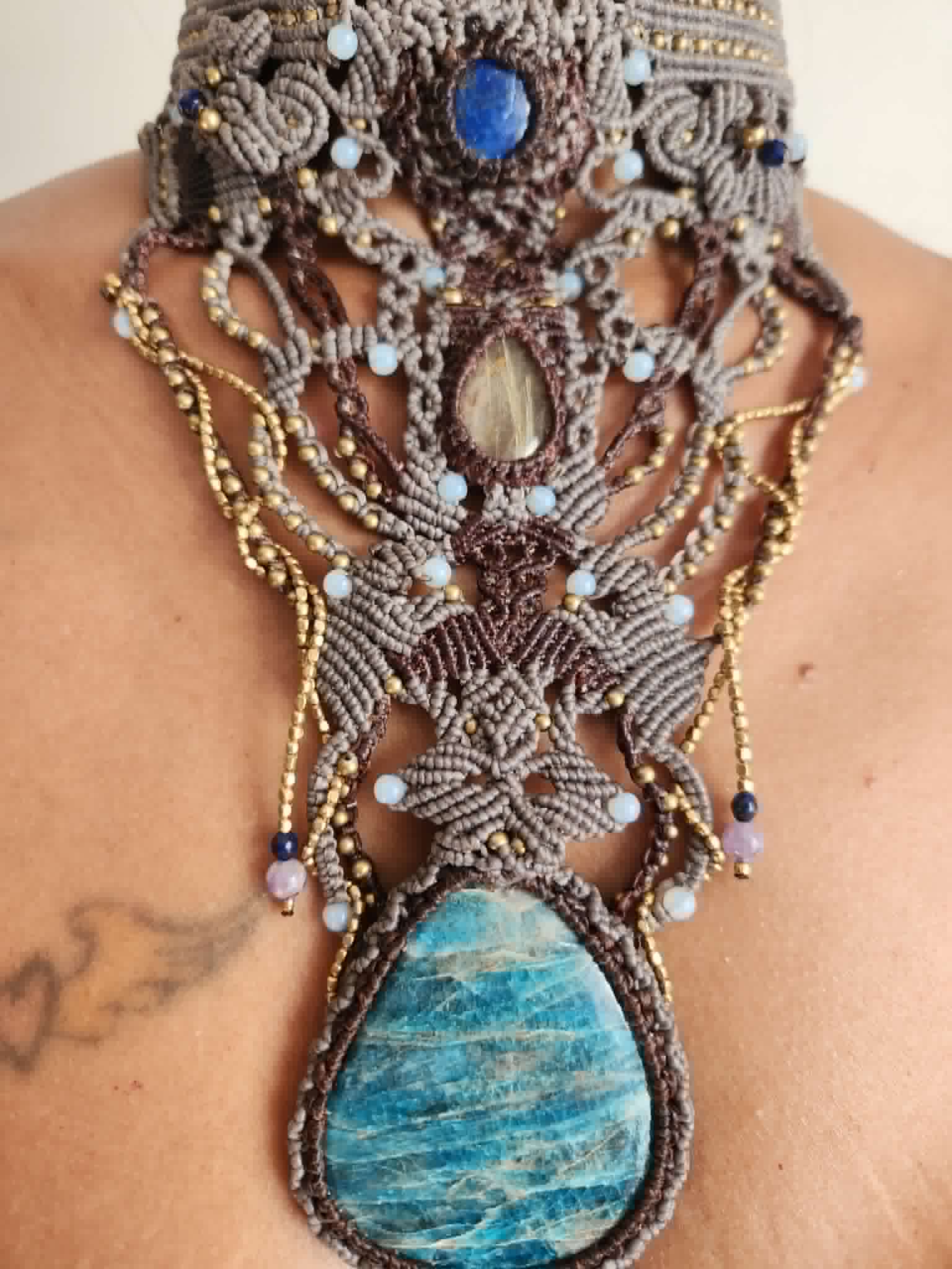 Apatite Pendant showcasing large natural blue apatite stone with ornate micromacramé choker and gemstone accents.