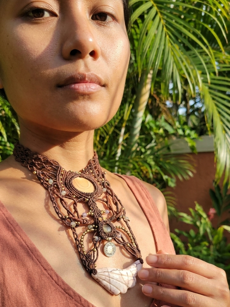 Jasper Necklace featuring hand-carved red vein jasper angel wing pendant displayed on a model outdoors.