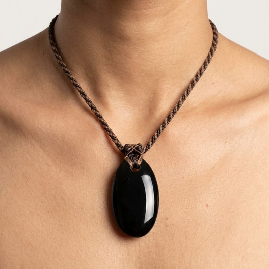 Black Onyx Necklace – Midnight Wanderer Talisman featuring a natural black onyx pendant on a macramé cord.