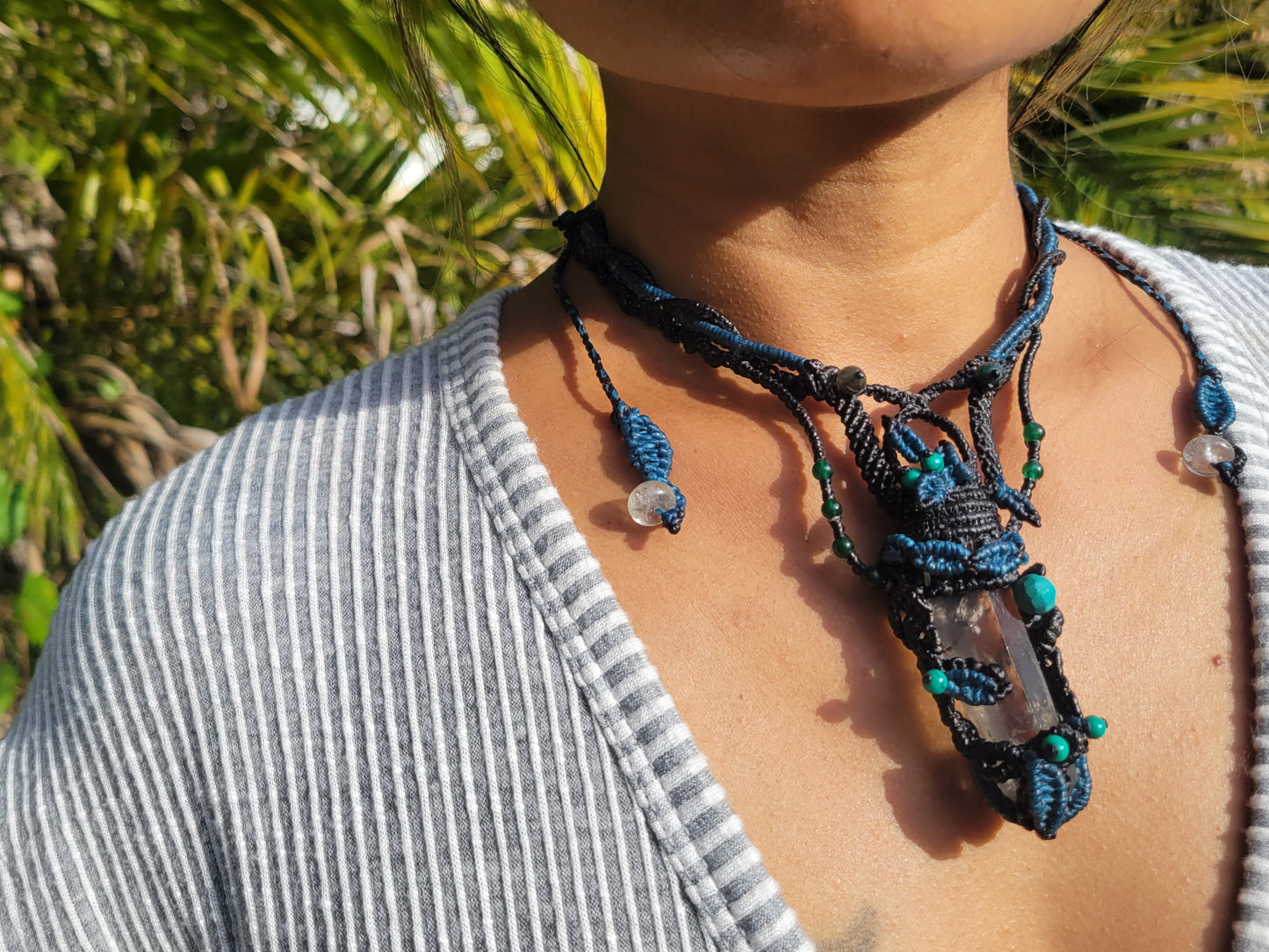 Festival-style quartz pendant wrapped in brown macramé