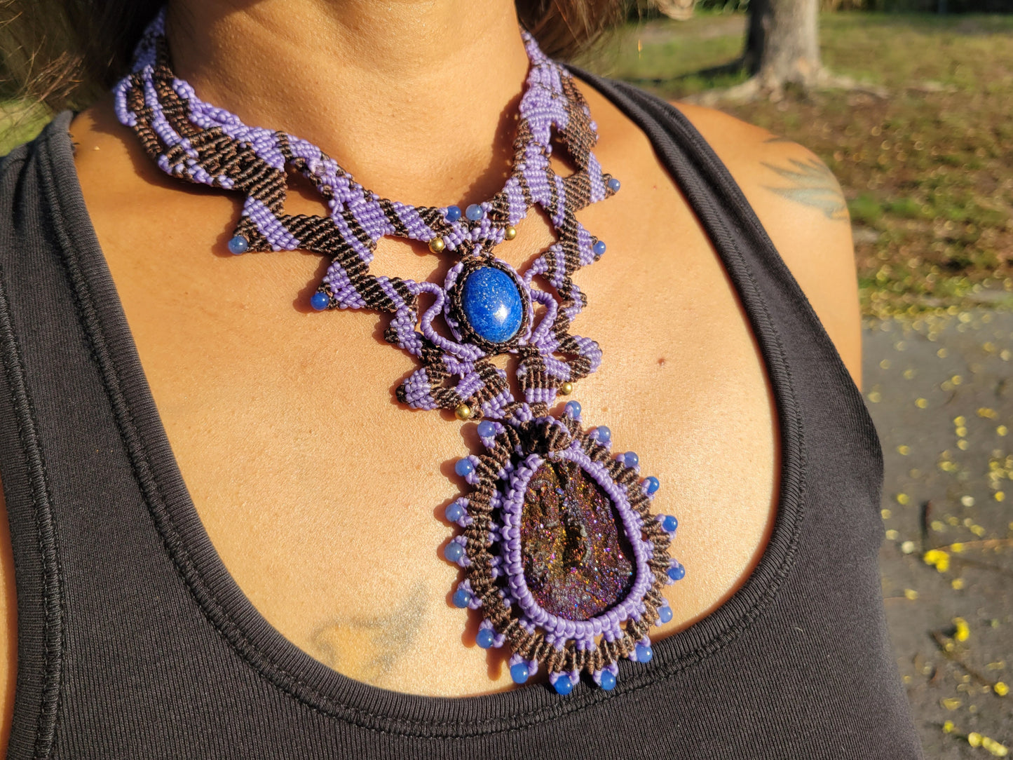 detailed purple beaded necklace with blue stones