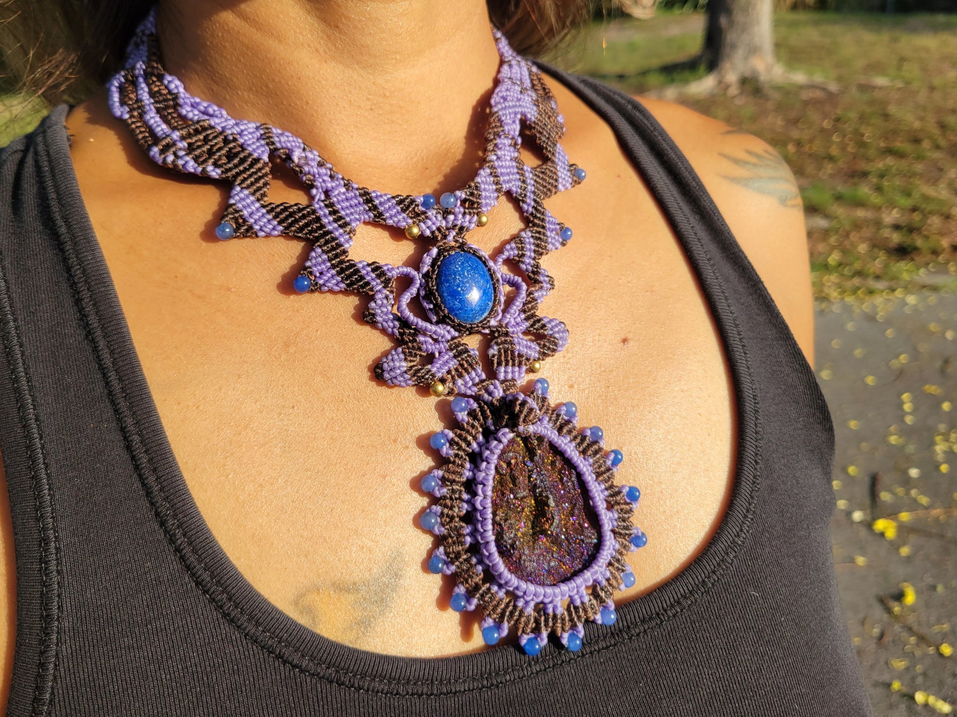 detailed purple beaded necklace with blue stones