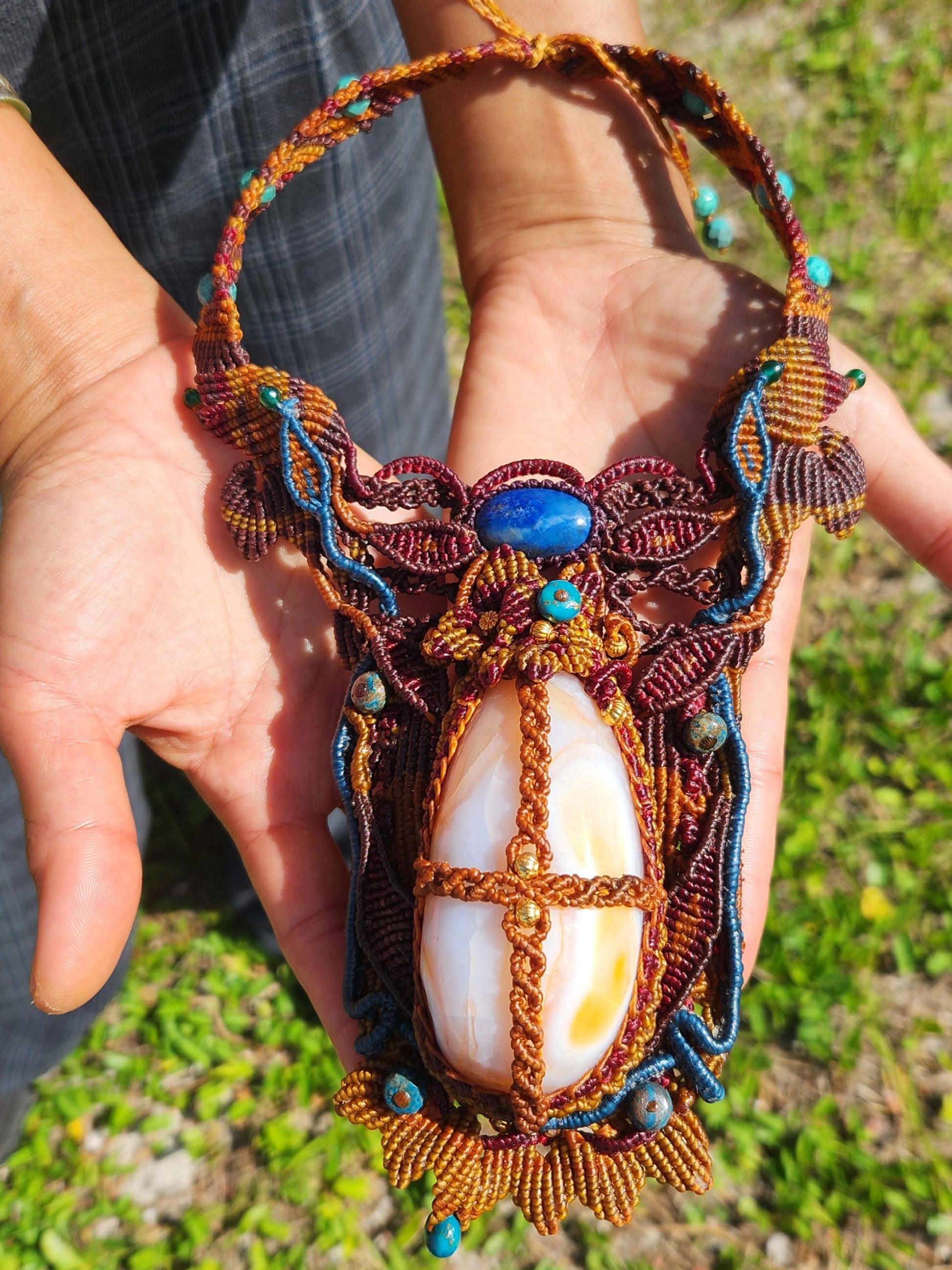 Carnelian Pendant featuring large carnelian agate stone, lapis lazuli, and intricate micromacramé design.