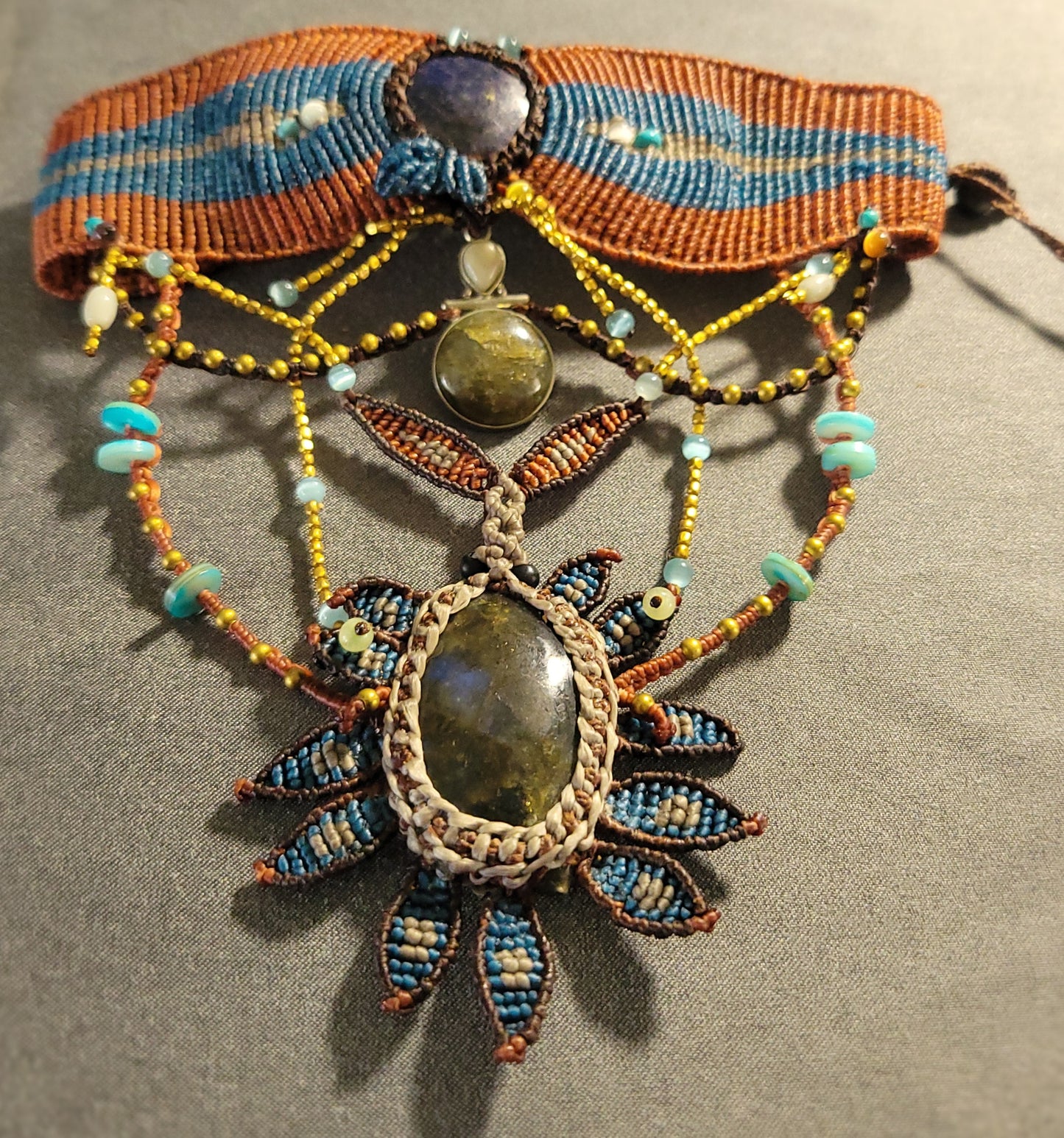 Labradorite Necklace – Dark Sunflower Goddess with large labradorite stone and ornate micromacramé design.