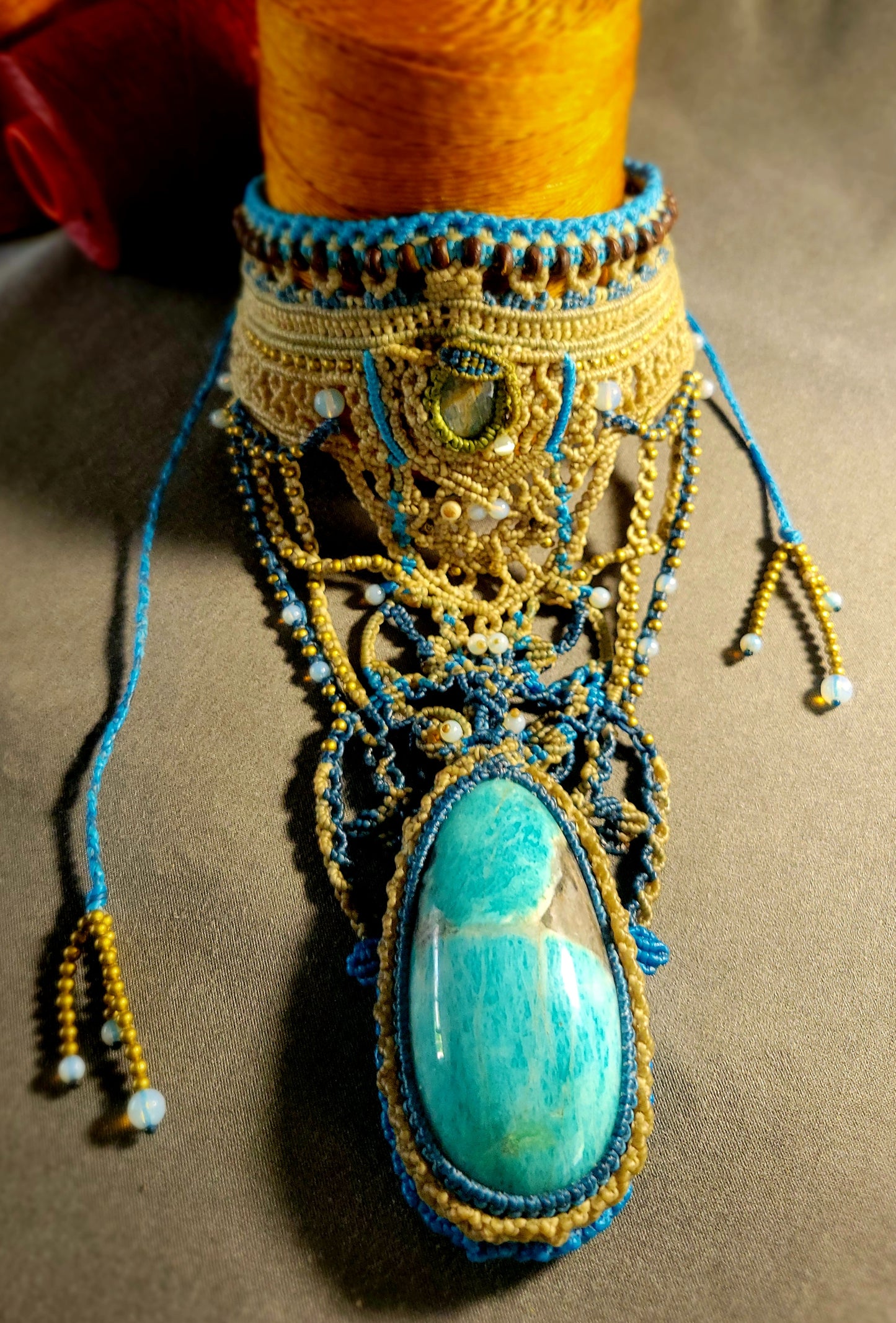 Amazonite Pendant Necklace featuring a large natural amazonite stone on a micromacramé choker with colorful accents.