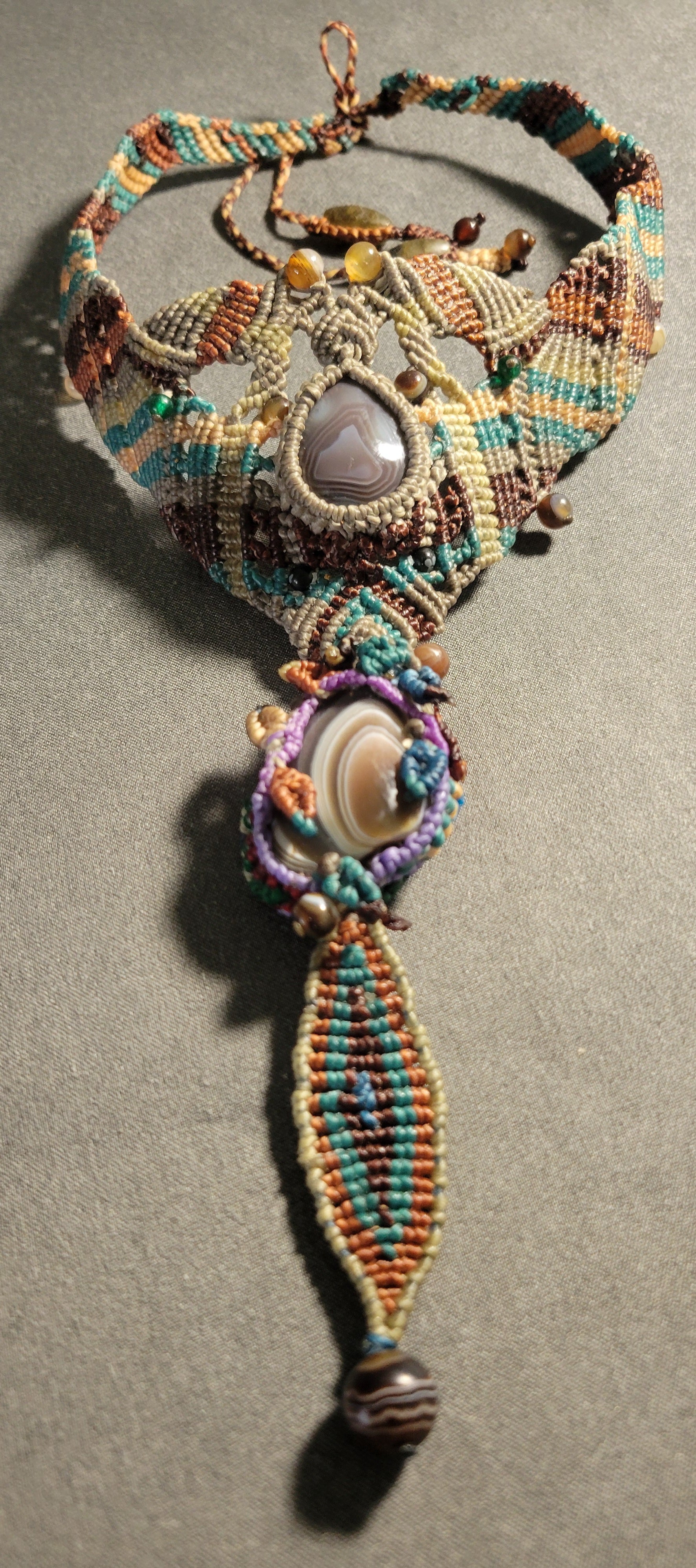 Botswana Agate double-pendant boho tribal choker featuring macramé and earthy tones, adjustable for comfort.