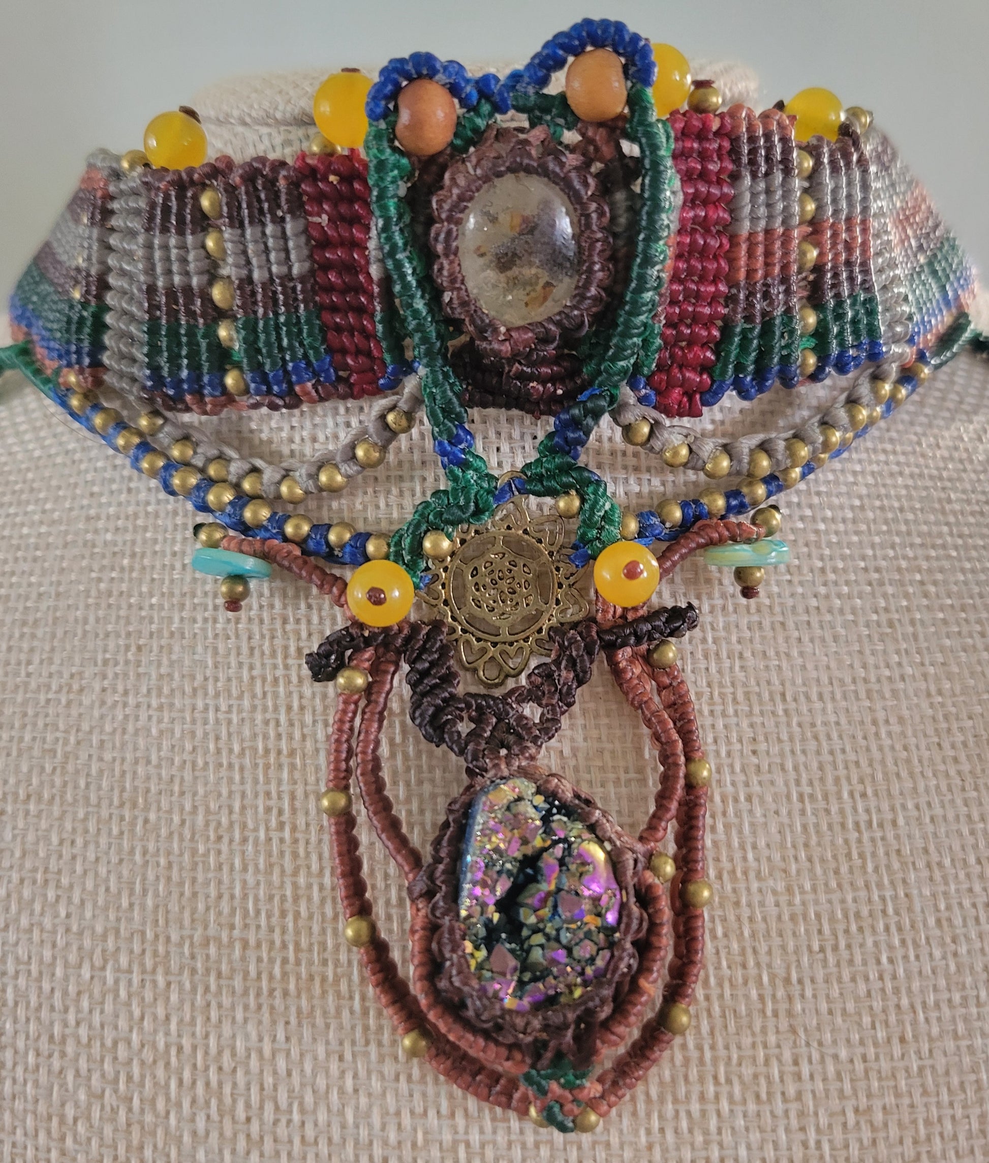 Titanium Aura Pendant – Sacred Geometry Spiritual Choker with intricate micromacramé and colorful beads.