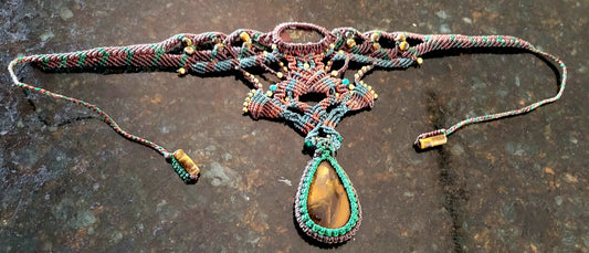 Iron Tiger's Eye Pendant showcased in a micromacramé choker with colorful cord and intricate knotwork.