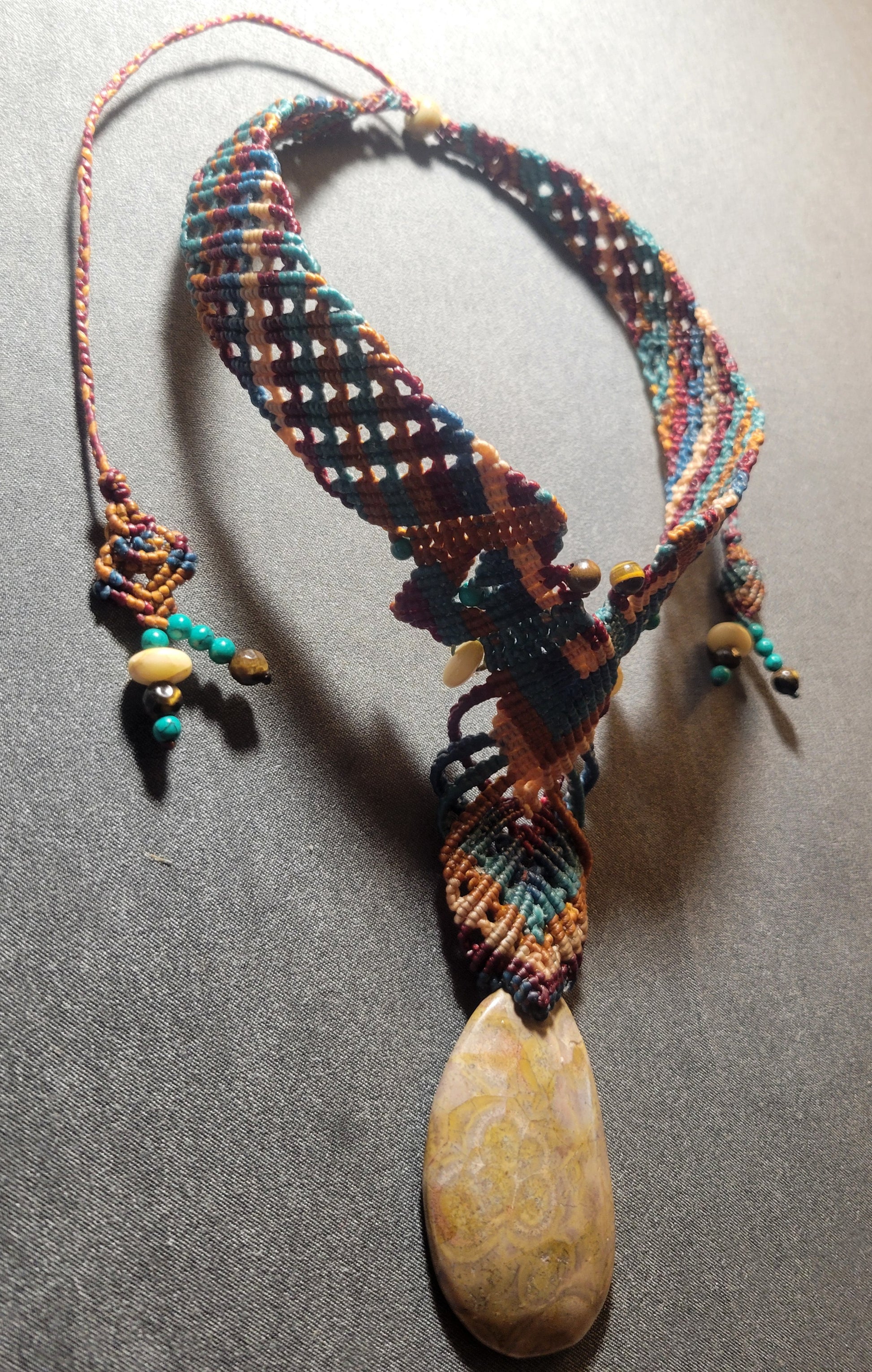 Fossilized Coral – Tribal Ocean Necklace with Native-Inspired Design featuring a large fossilized coral stone and macramé choker.