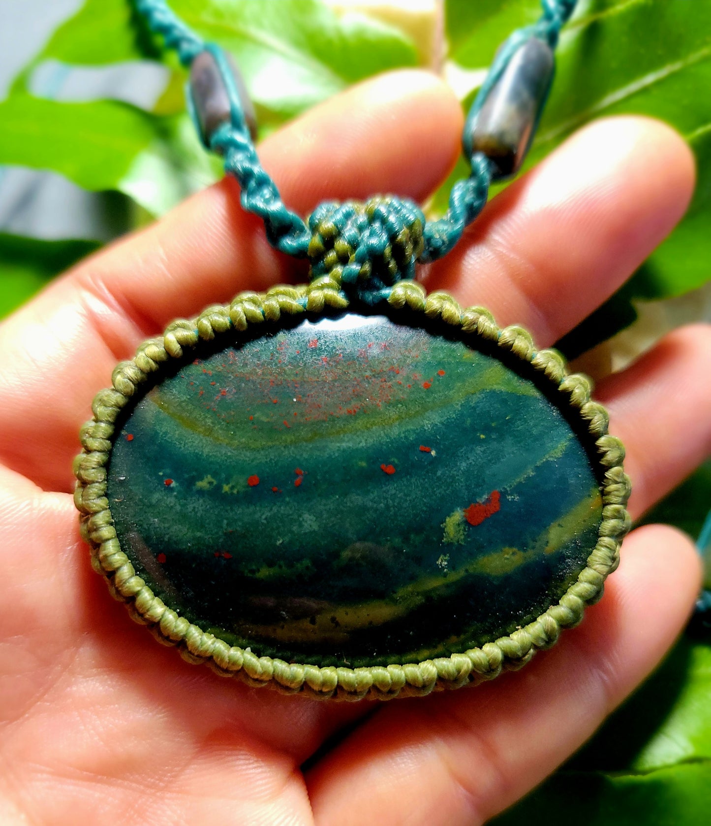 Orbicular Bloodstone Pendant – Handmade pendant with green and red stone, moss agate accents, and adjustable cord.