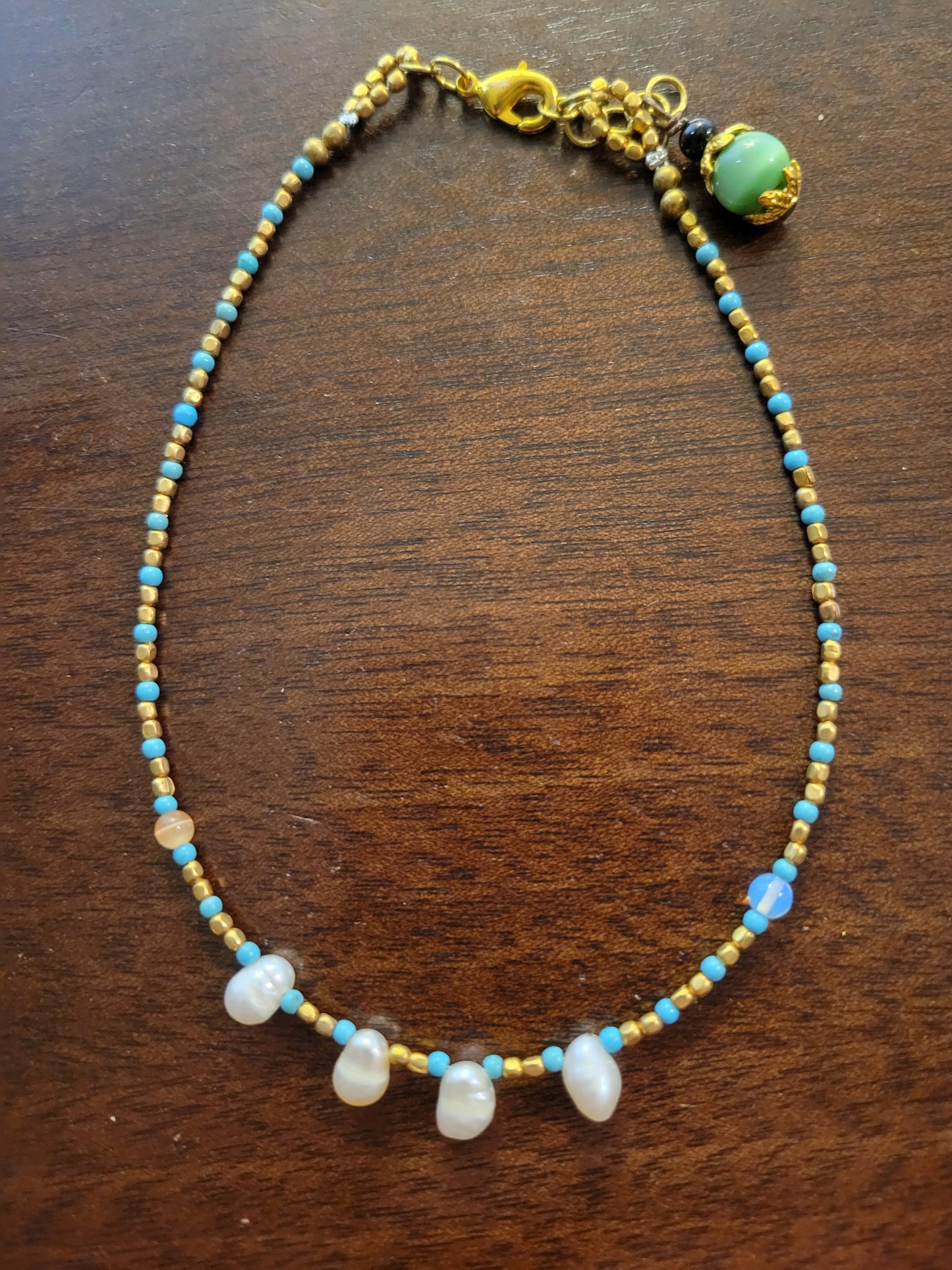 Boho Anklets – Beaded ocean charm anklet featuring cat's eye stone beads and brass with shells.