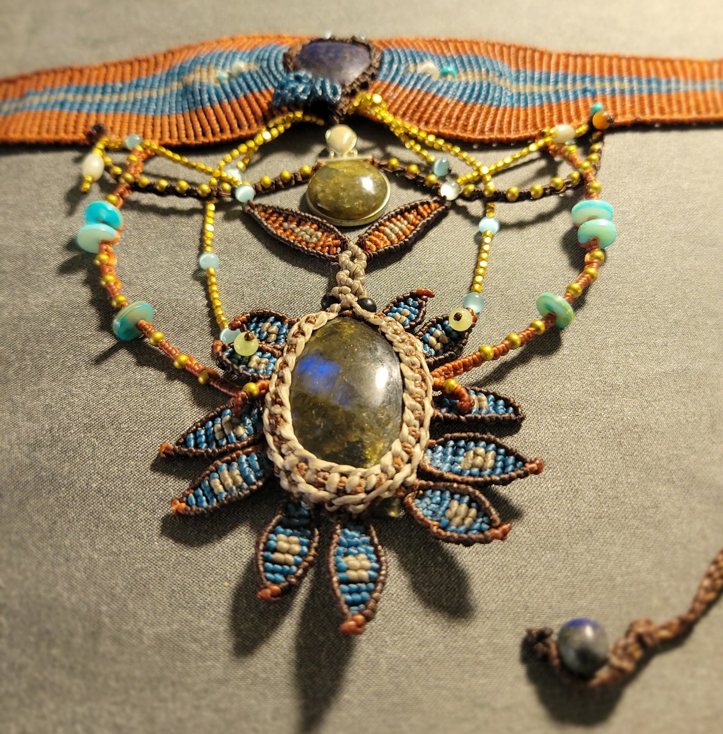 Labradorite Necklace – Dark Sunflower Goddess featuring a large labradorite stone and intricate micromacramé design.