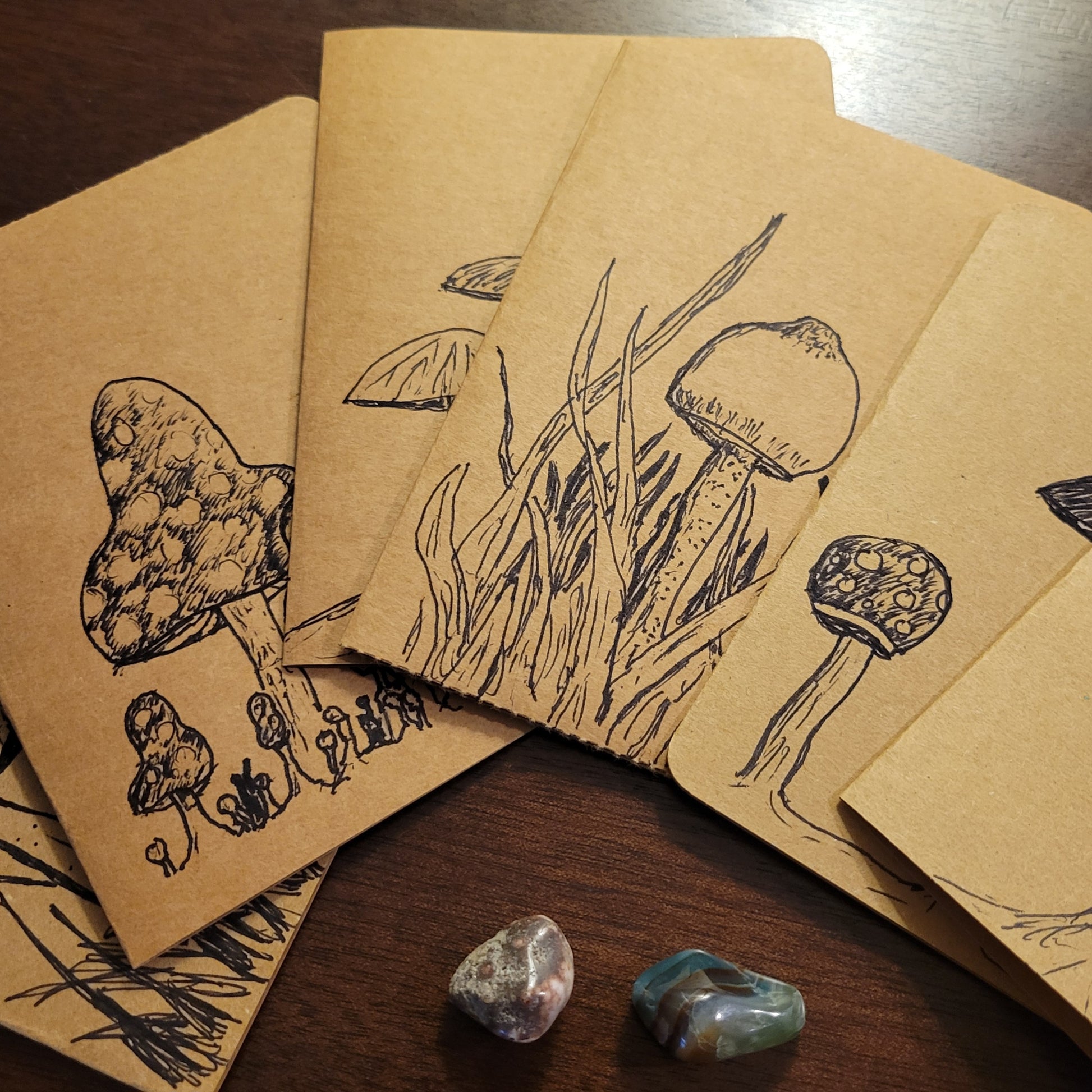 Handmade Cards featuring original sketches of mushrooms from the Fungal Ant Series on a wooden table.