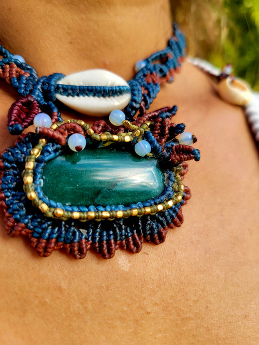 Sunburst pendant with malachite stone and cowrie shell