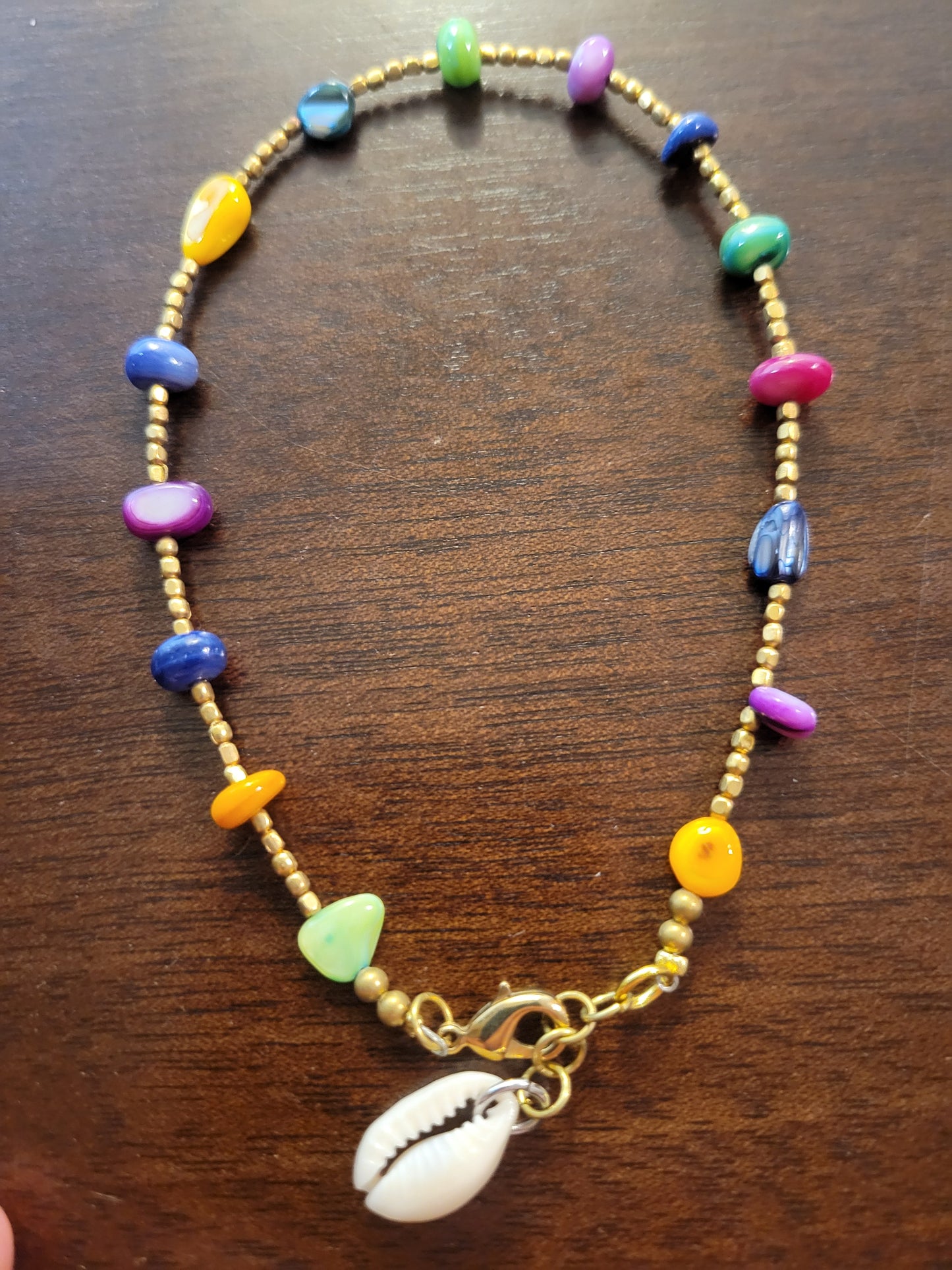 Boho Anklets – Beaded ocean charm anklet with colorful beads and cowrie shell accent.