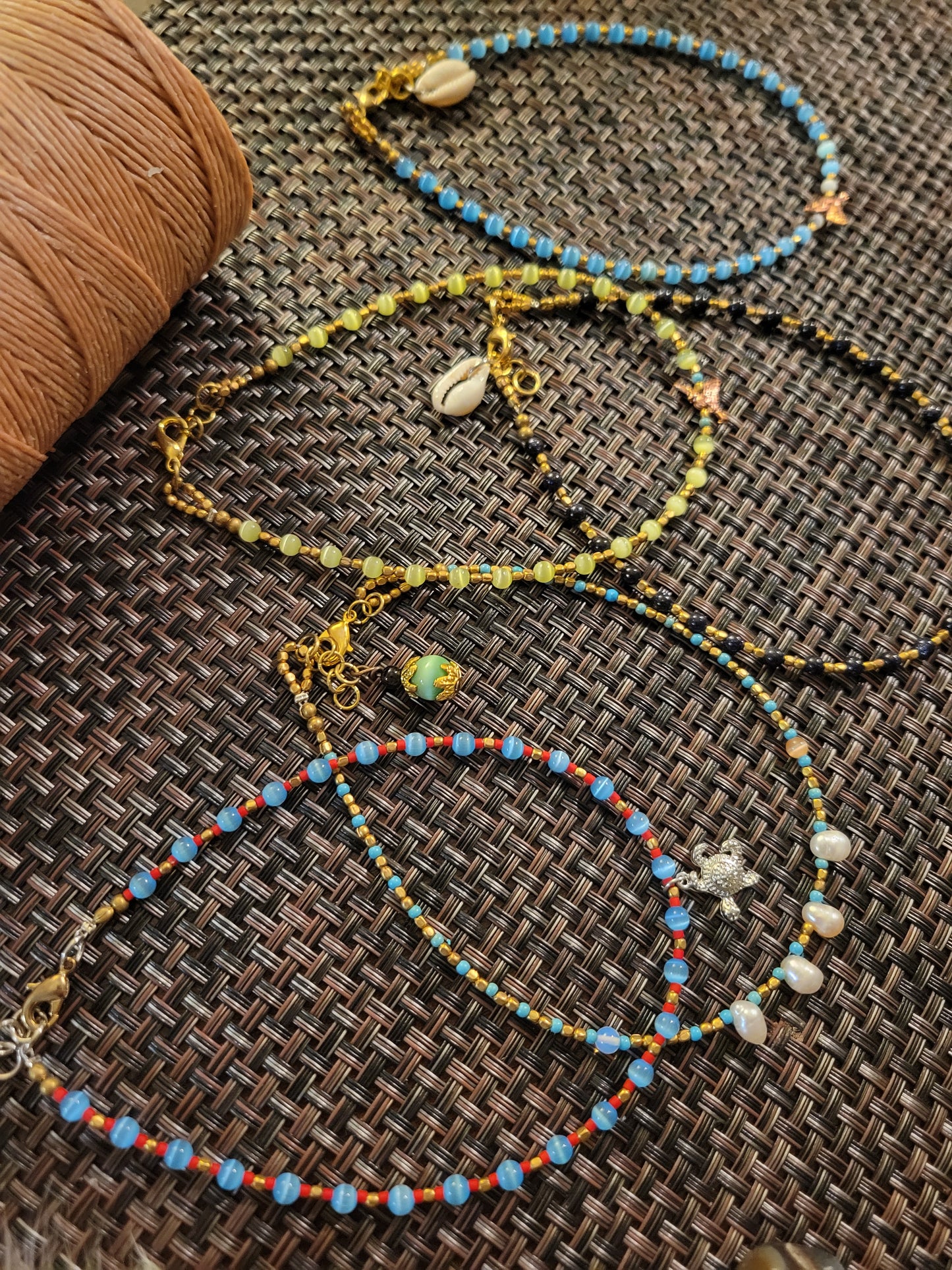 Boho Anklets featuring colorful beaded ocean charm designs with shells, adjustable length for comfortable wear.