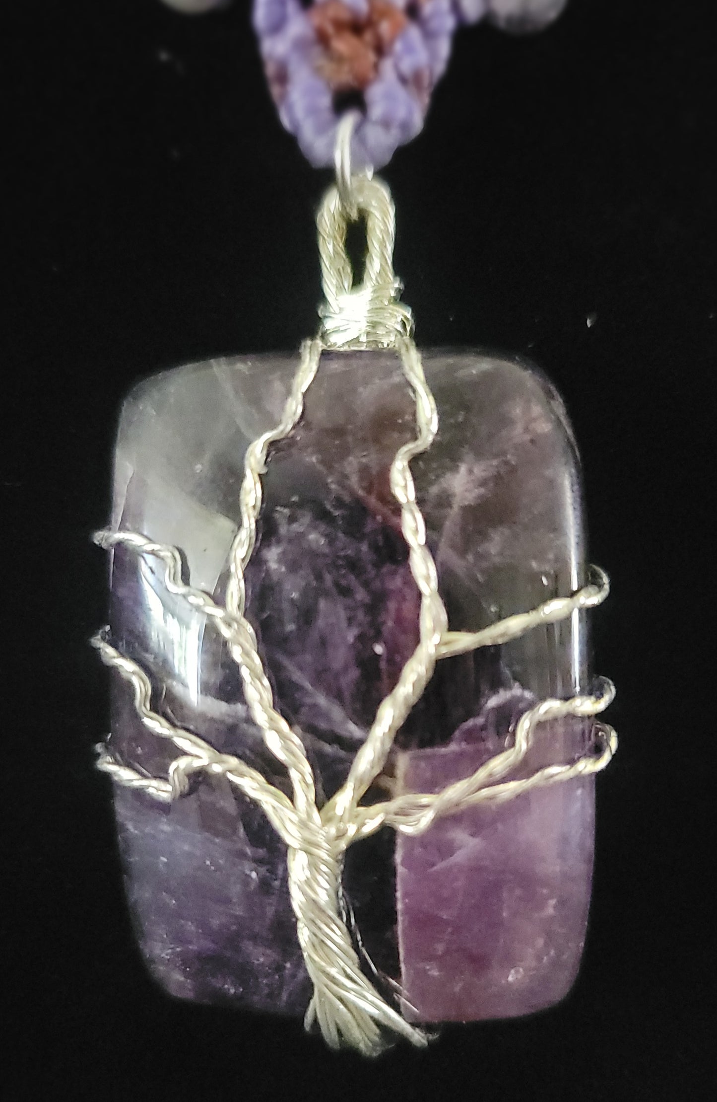 Amethyst Pendant Necklace featuring a square amethyst stone wrapped in a Tree of Life design.