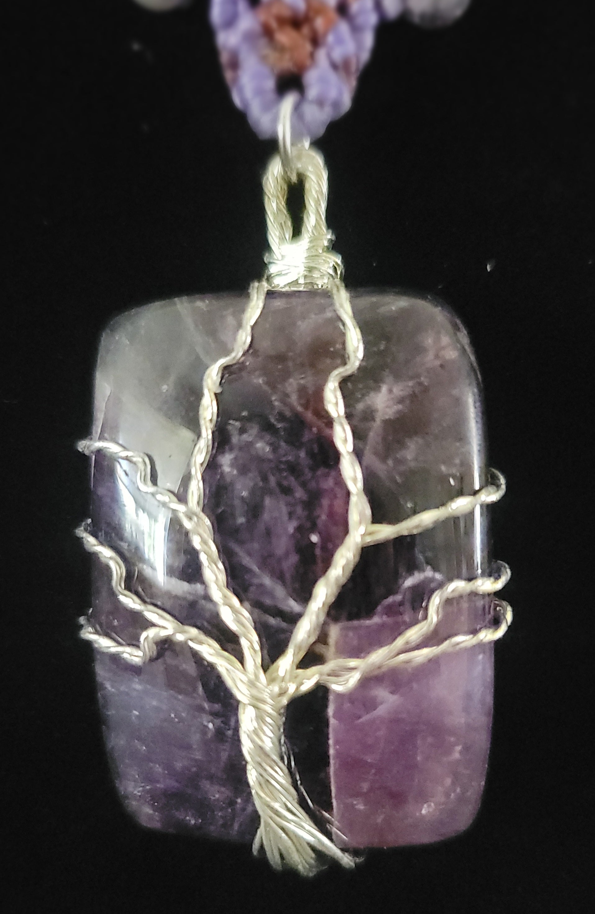 Amethyst Pendant Necklace featuring a square amethyst stone wrapped in a Tree of Life design.