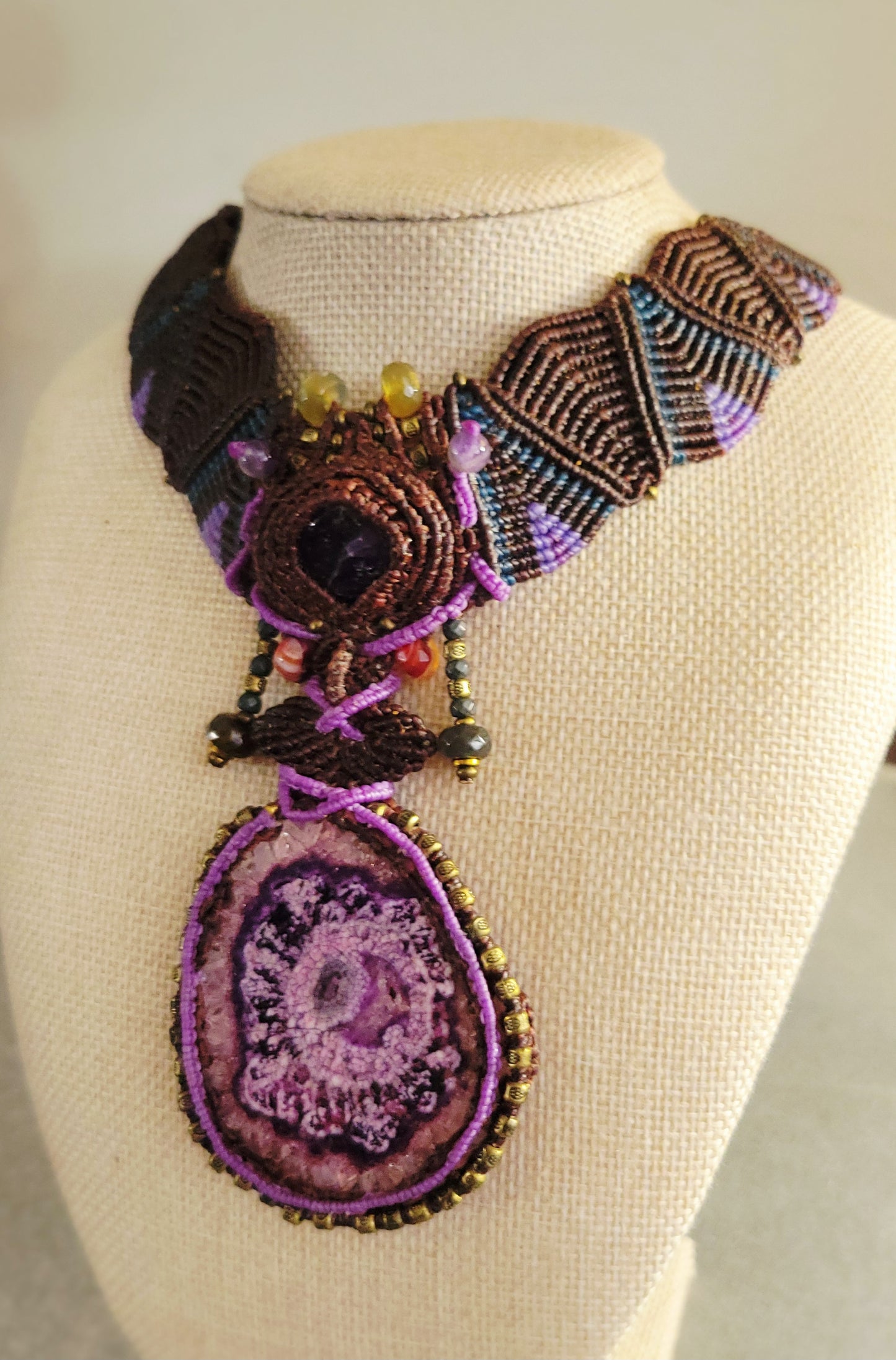 Agate Necklace – purple stalactite slice pendant on thick micromacramé choker with colorful beads.