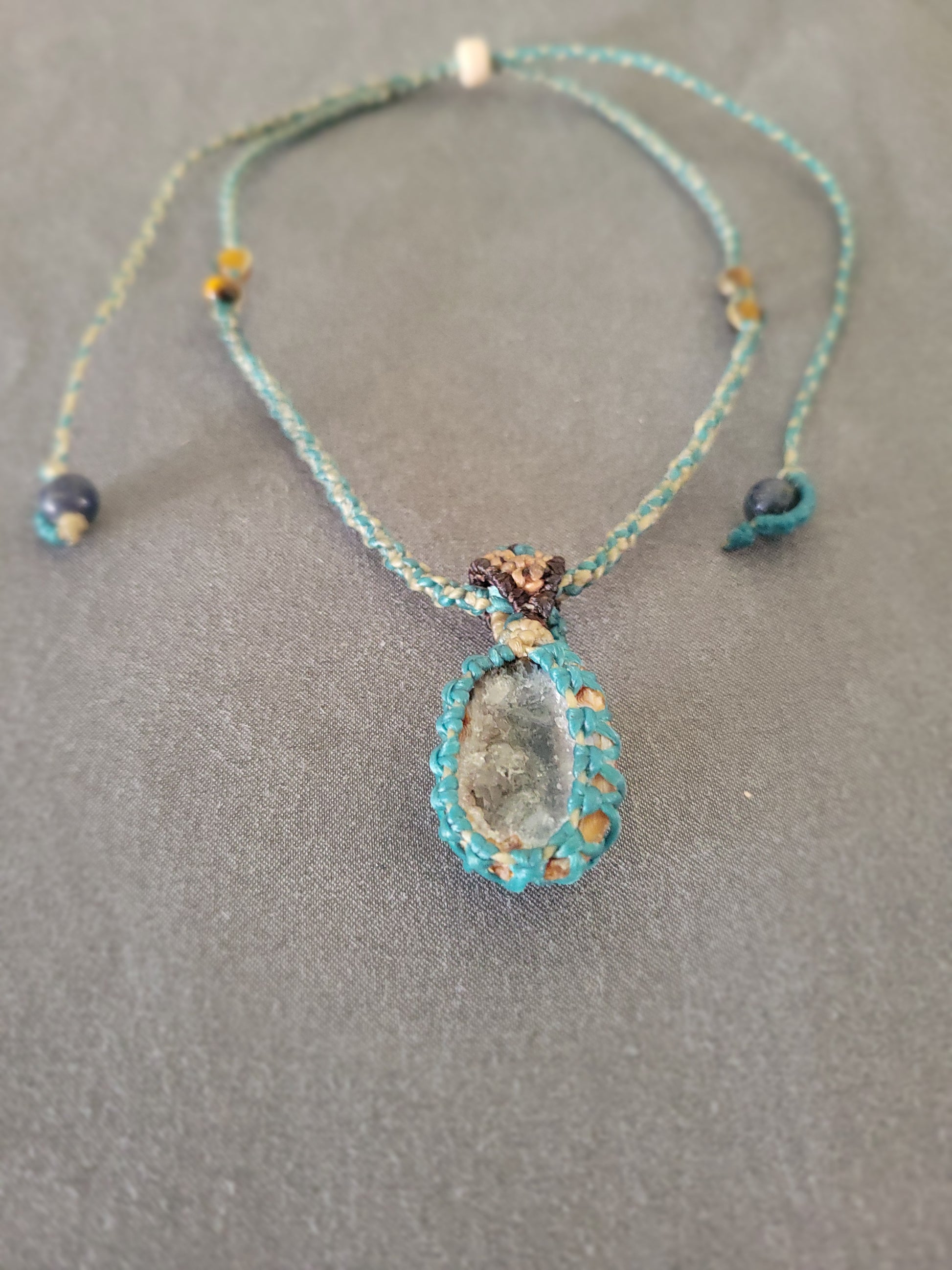 Agate Necklace – 'Shining with Grace' Natural Geode Pendant on a grey backdrop with aquamarine accents.