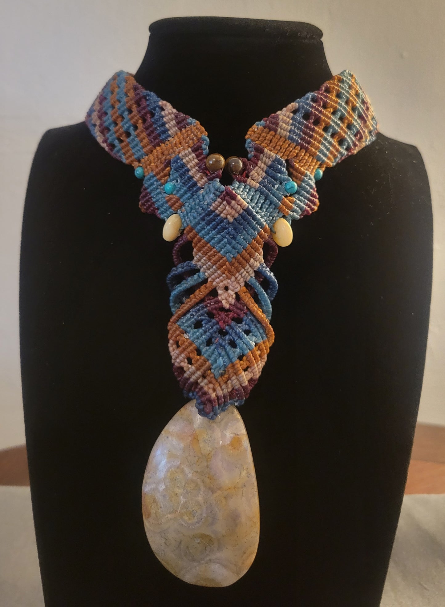 Fossil jewelry choker with stone beads and earth-tone cords