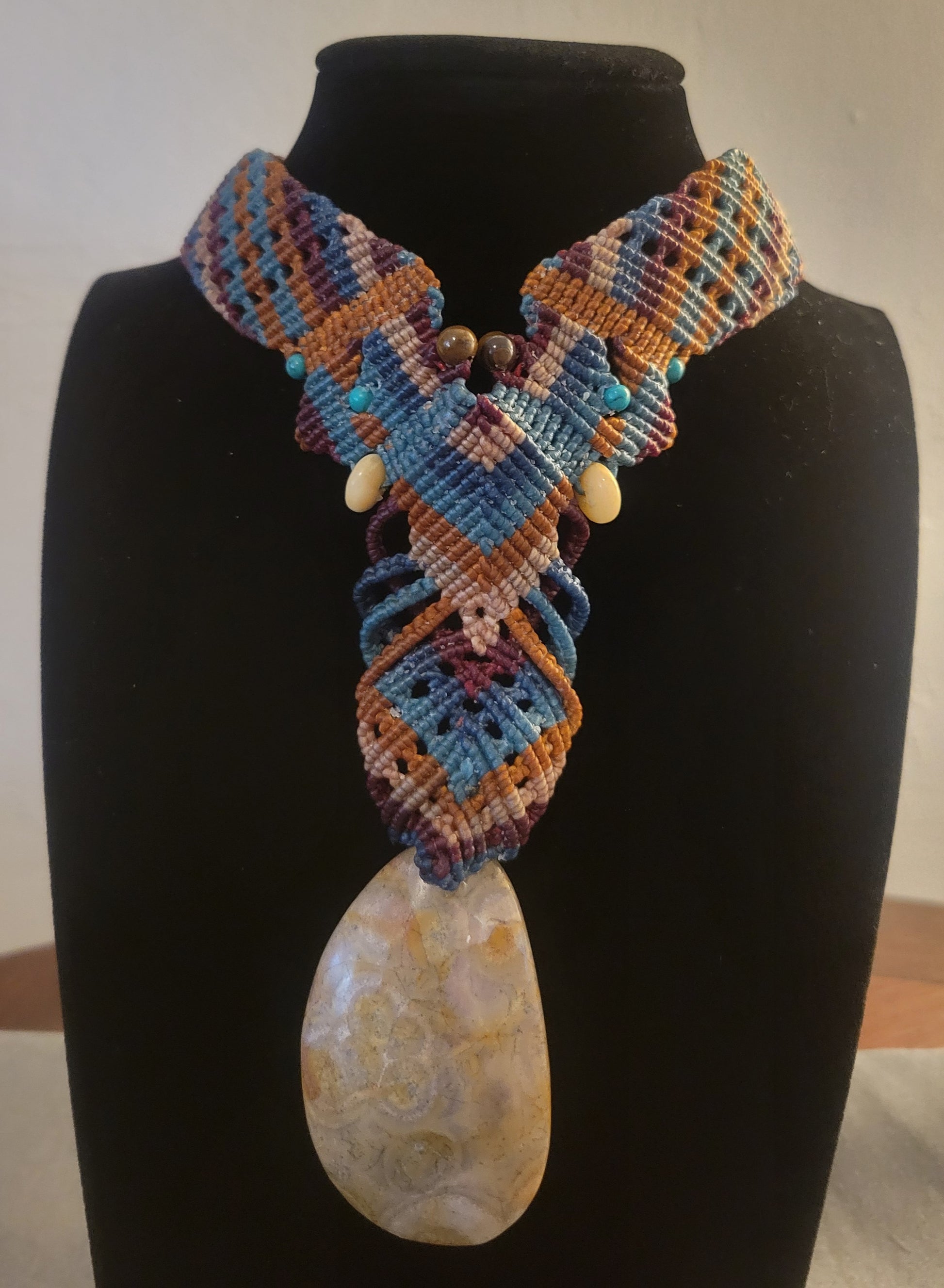 Fossil jewelry choker with stone beads and earth-tone cords