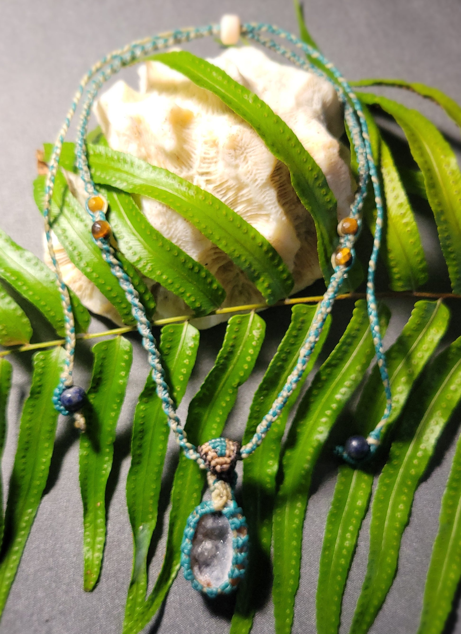 Agate Geode Pendant – Purple Snow Druzy Spiral Boho Necklace with teal braided cord and natural stone bead accents.