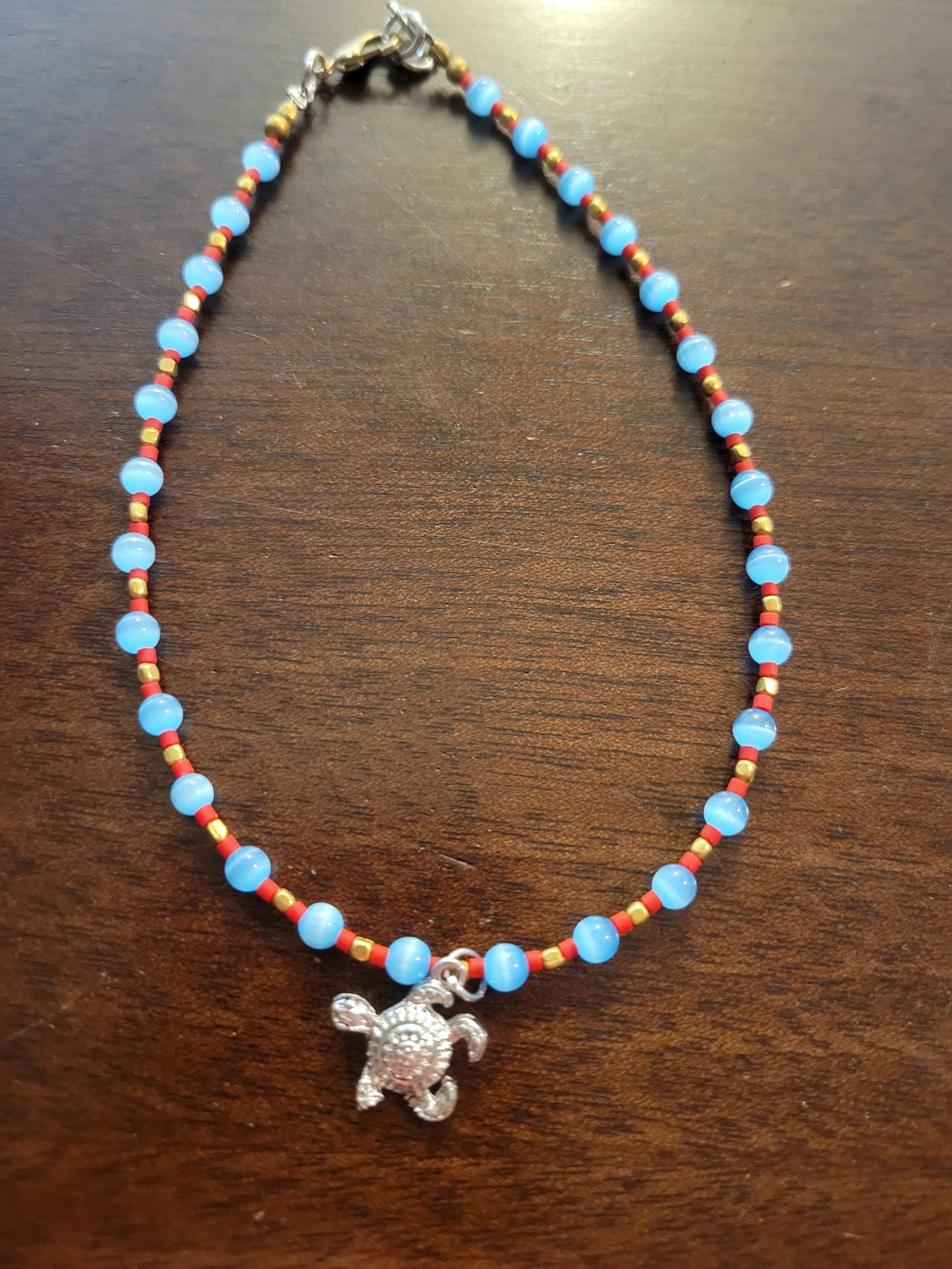 Boho Anklets – Beaded ocean charm anklet featuring a silver sea turtle charm and colorful beads.