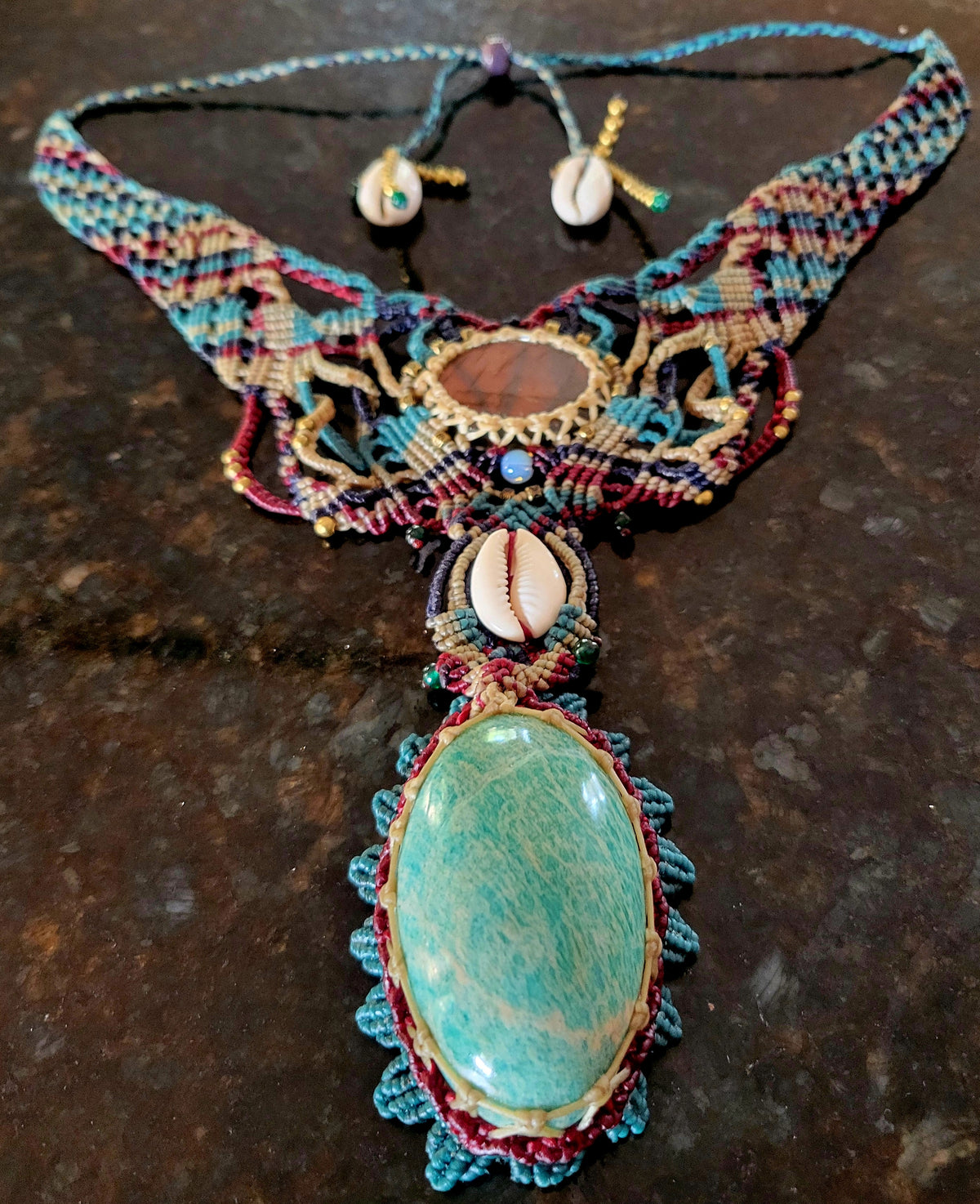 Amazonite Pendant Necklace featuring natural gemstones, intricate micromacramé design, and rare cowrie shell accents.