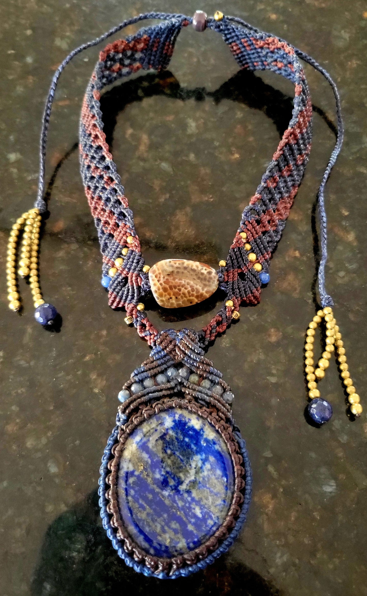 Lapis Lazuli Necklace featuring a large convex-cut pendant and elegant micromacramé design with blue stone accents.