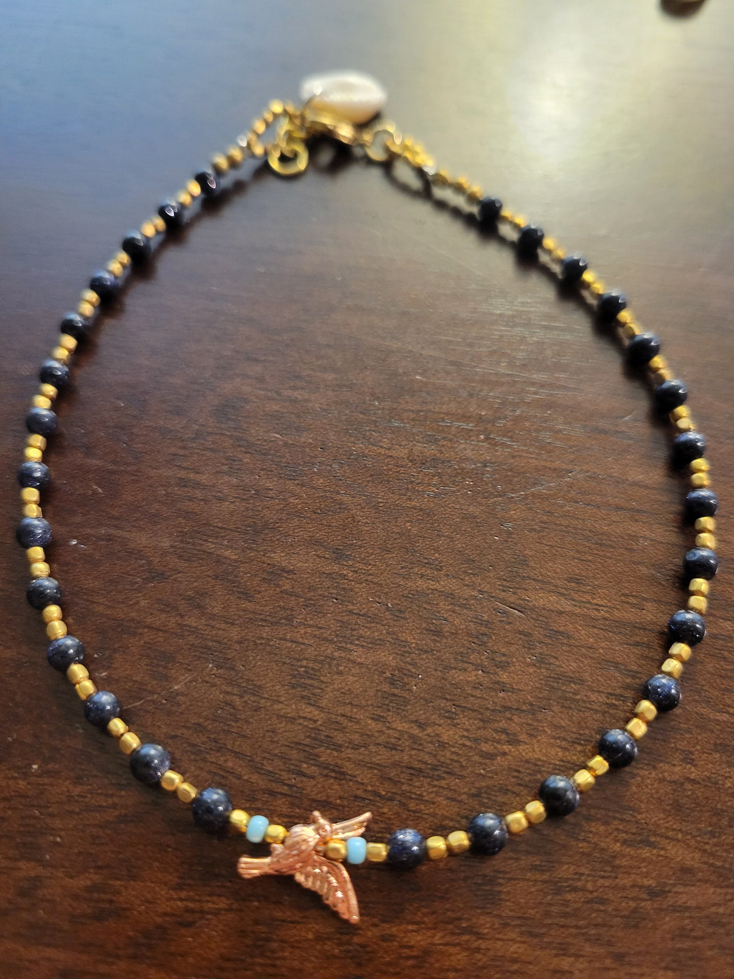 Boho Anklets – Beaded ocean charm anklet featuring colorful beads and a bird charm for a stylish look.