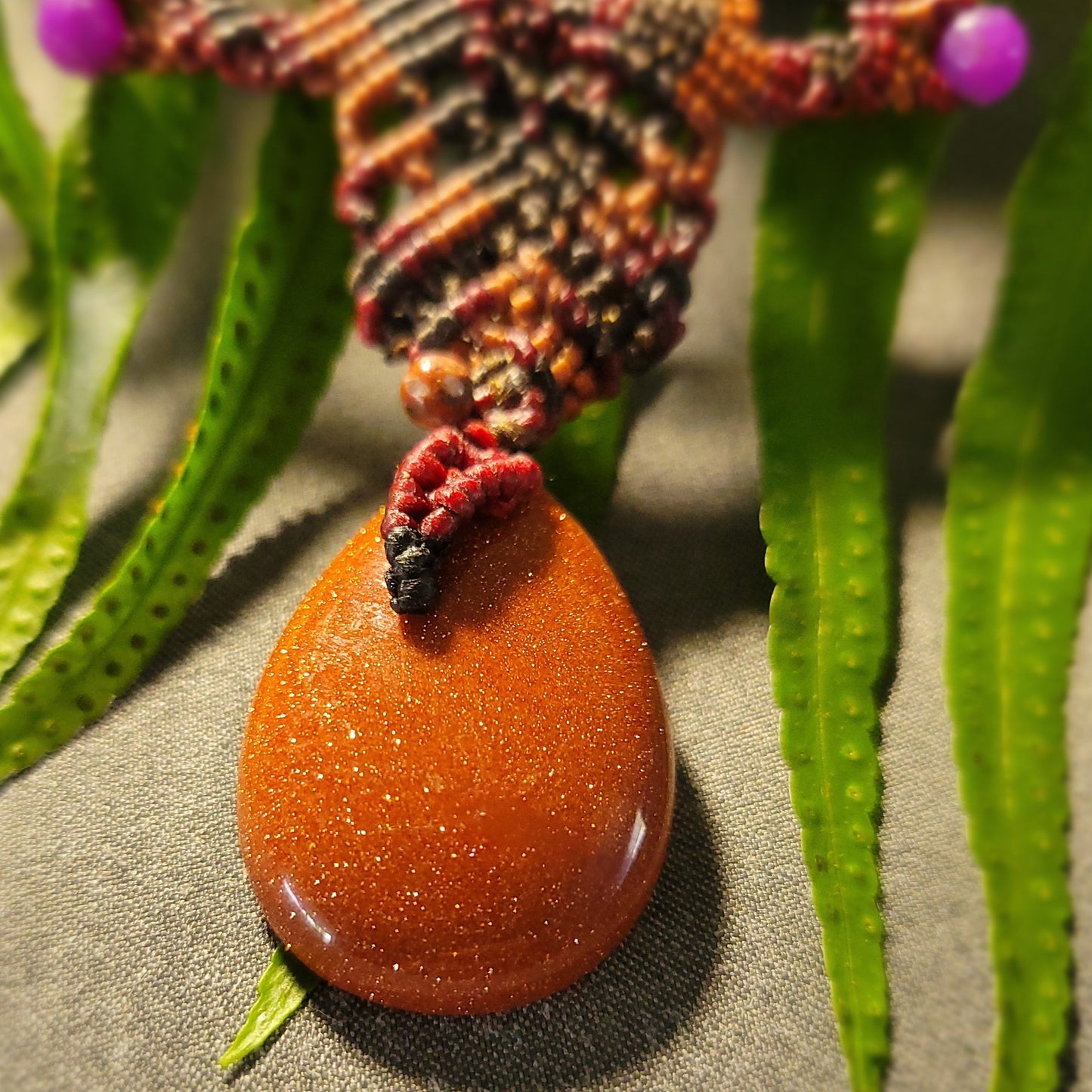 Golden sand stone pendant on dark brown macramé necklace