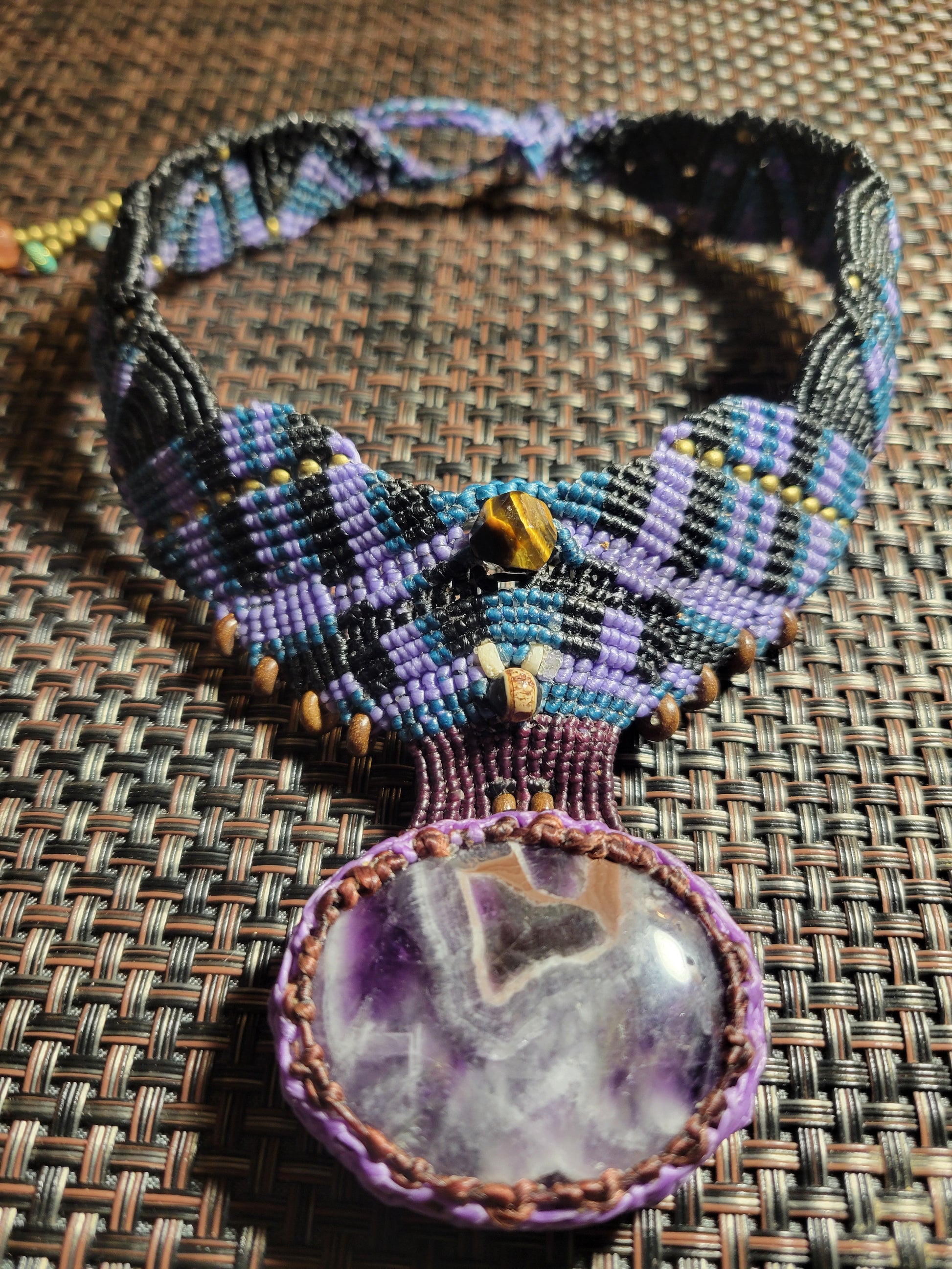 Amethyst Crystal Pendant – Large purple amethyst crystal on a geometric micromacramé choker necklace.
