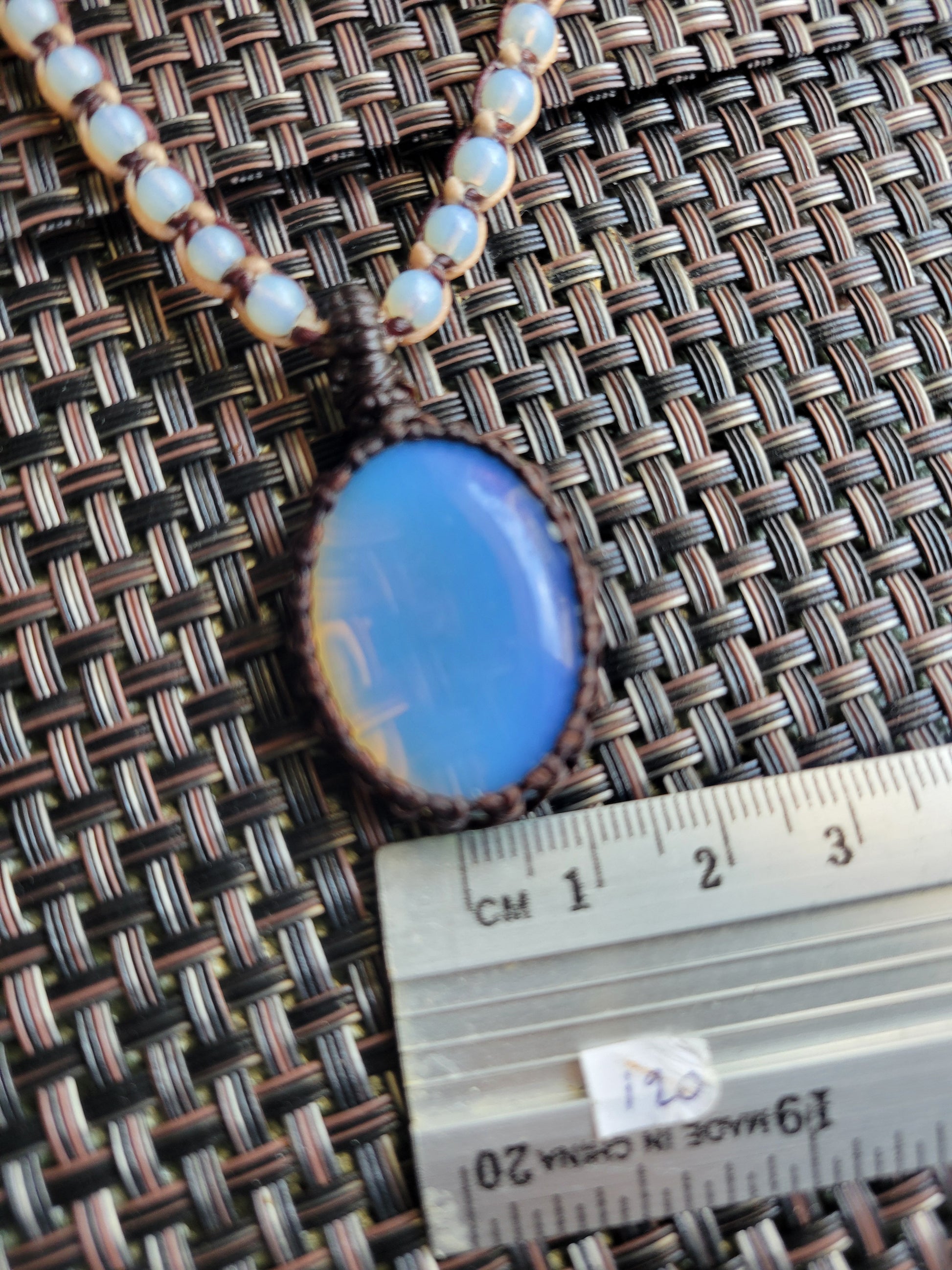 Opalite Pendant Necklace featuring a smooth opalite stone on a macramé rope necklace with matching beads.