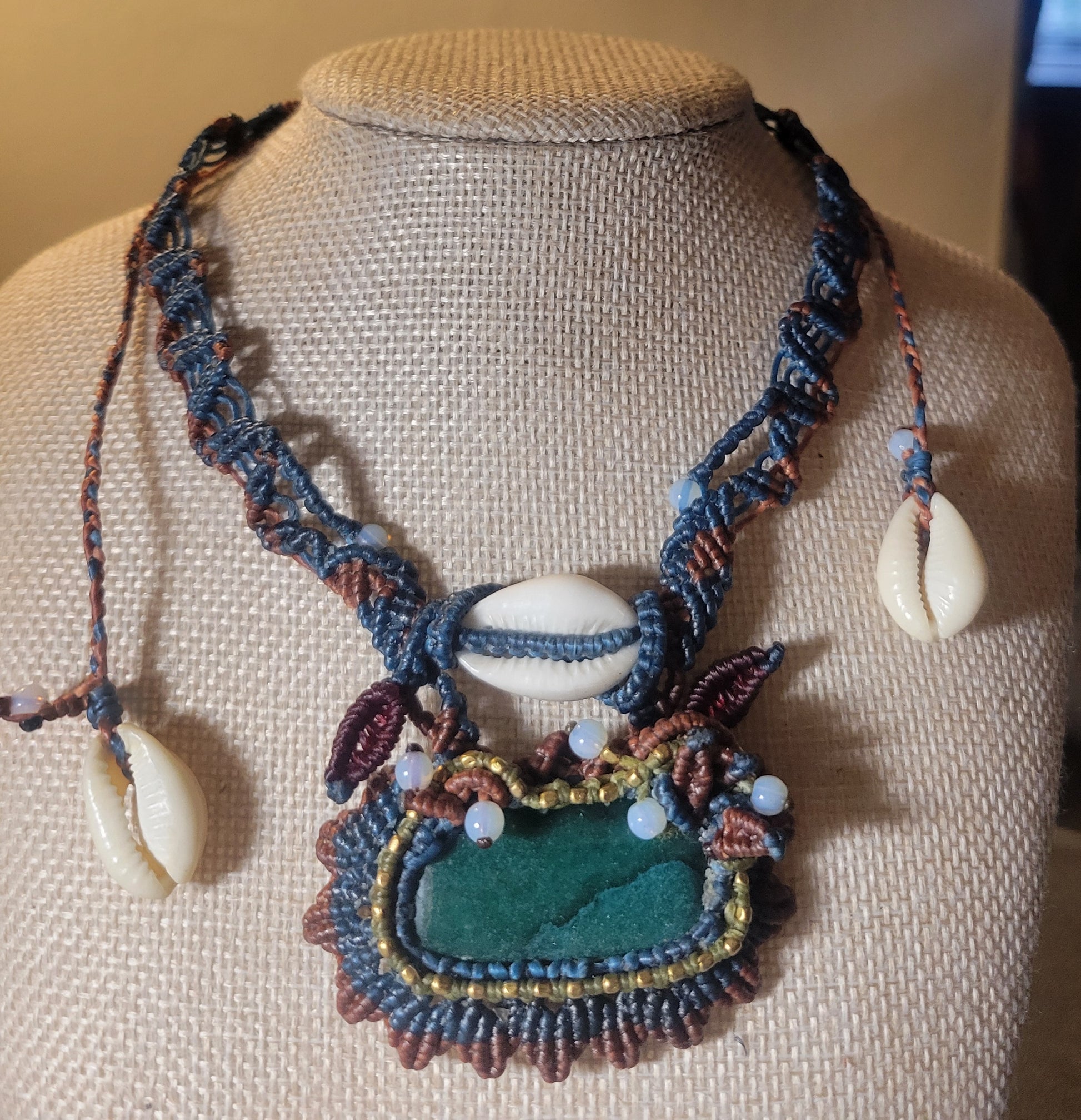 Malachite Jewelry – Handmade turquoise and brass sun pendant choker with cowrie shell accents.