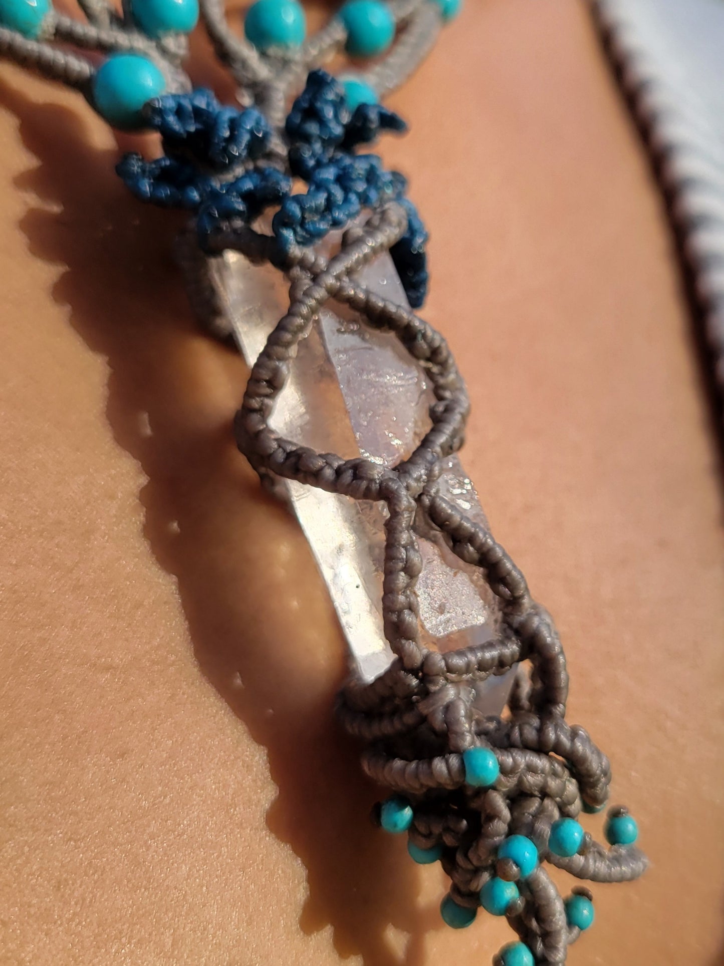 Clear quartz choker with tan macramé cords and blue beads