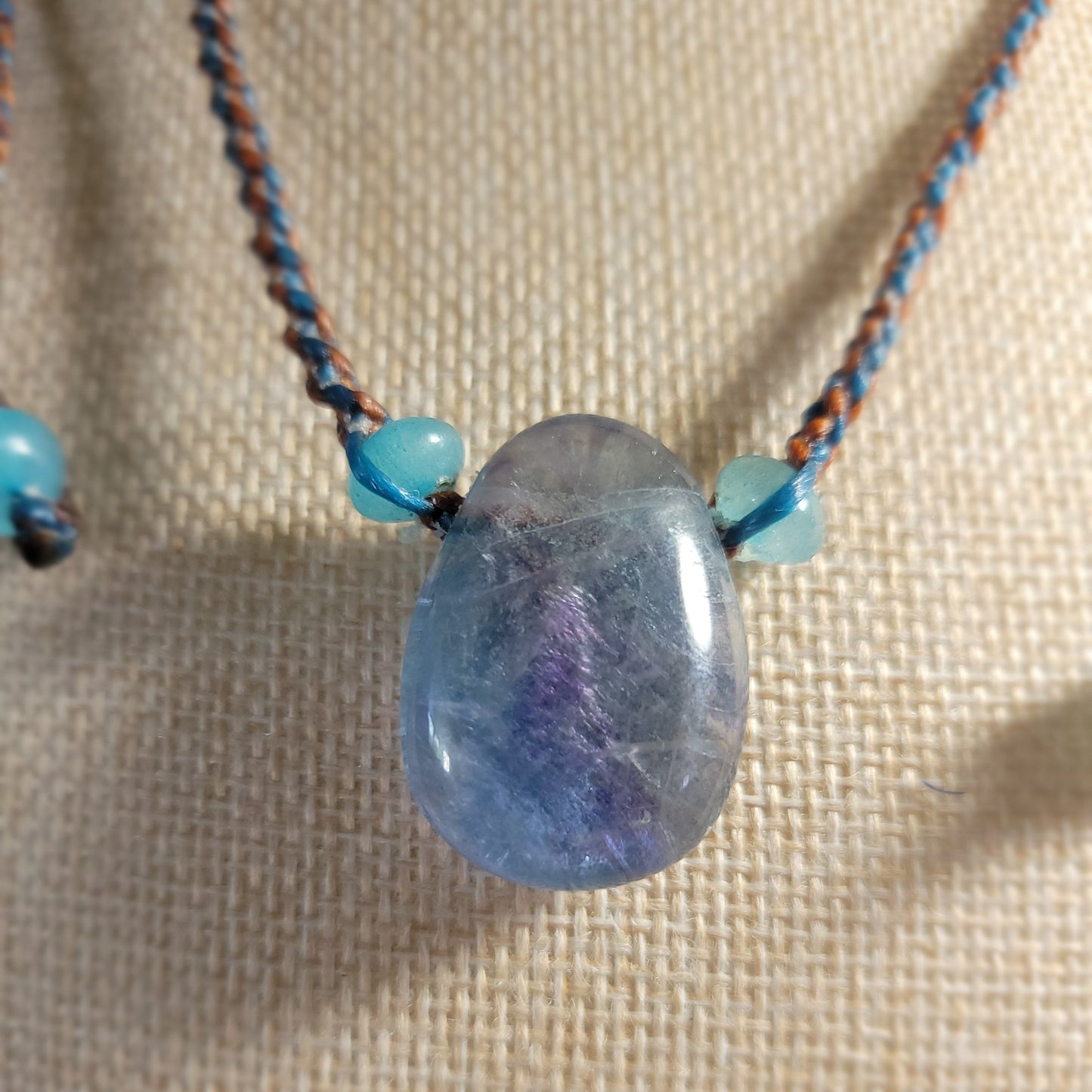 Minimalist fluorite pendant on tan braided cord