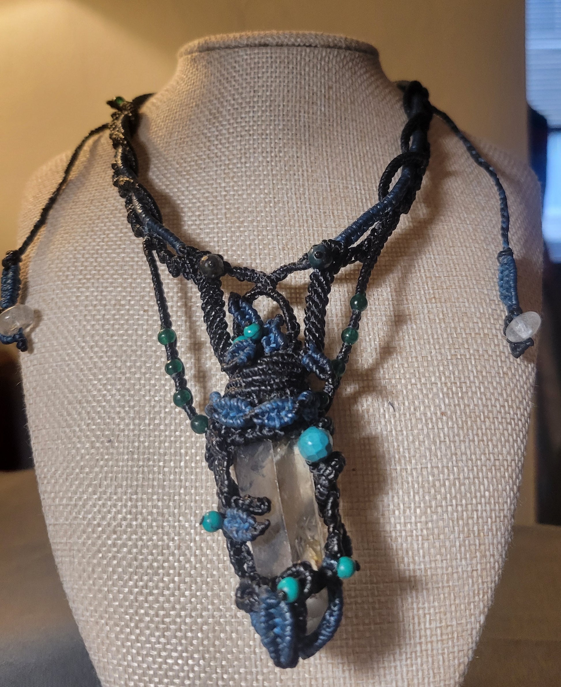 quartz crystal necklace with blue macramé leaves