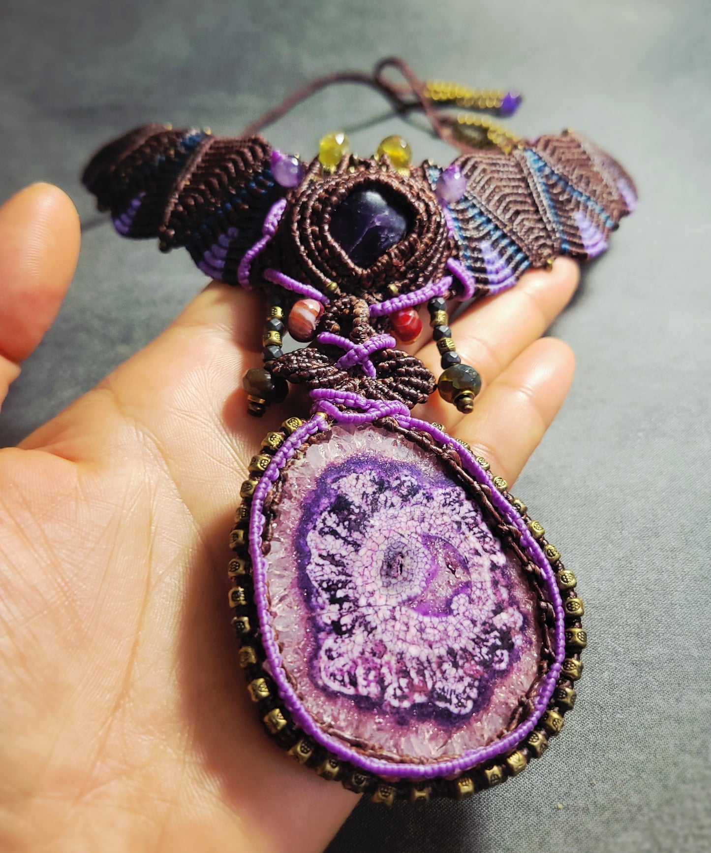 Agate Necklace featuring a large purple stalactite pendant and intricate micromacramé choker design.